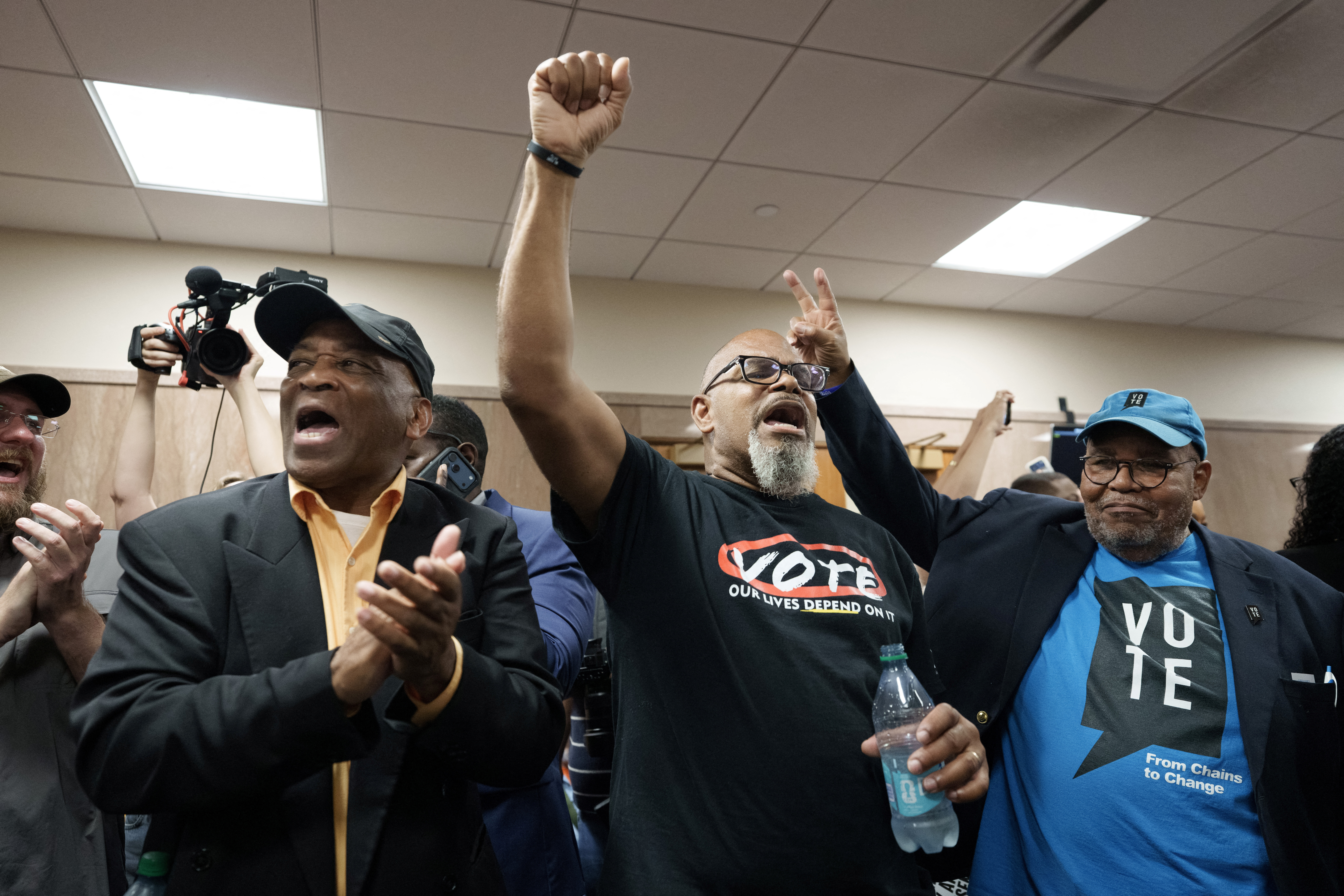 Mike McCallahan, President of the Louisiana’s NAACP chapter and others protest in front of the hearing room, during a public hearing on redistricting as Louisiana Republicans pursue a new congressional voting map ahead of the November midterm elections, in Baton Rouge, Louisiana, U.S., May 8, 2026. REUTERS/Wayan Barre
