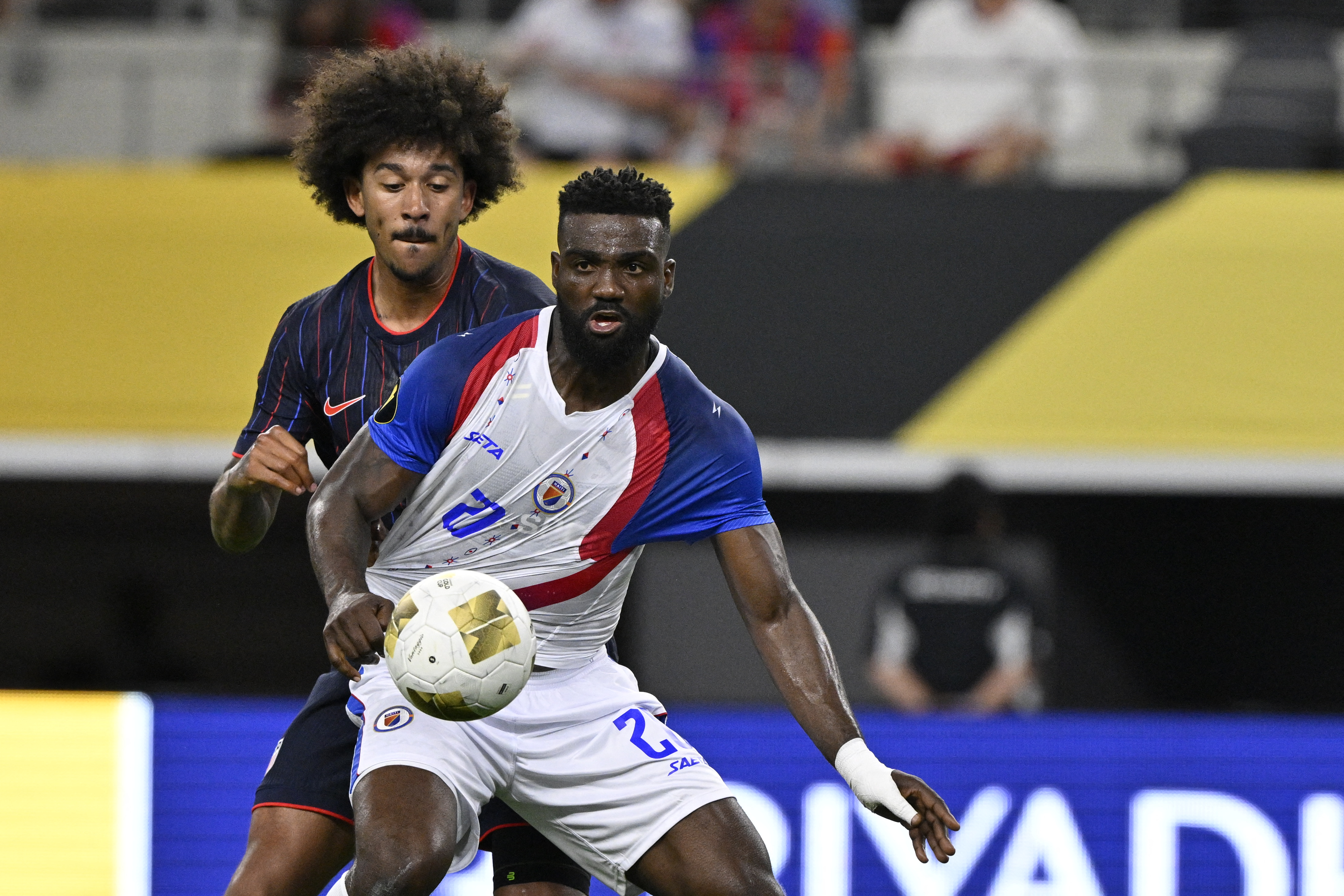Jun 22, 2025; Arlington, Texas, USA; Haiti forward Frantzdy Pierrot (20) reaches for the ball against United States of America defender Chris Richards (3) during the second half during a group stage match of the 2025 Gold Cup at AT&T Stadium. Mandatory Credit: Jerome Miron-Imagn Images