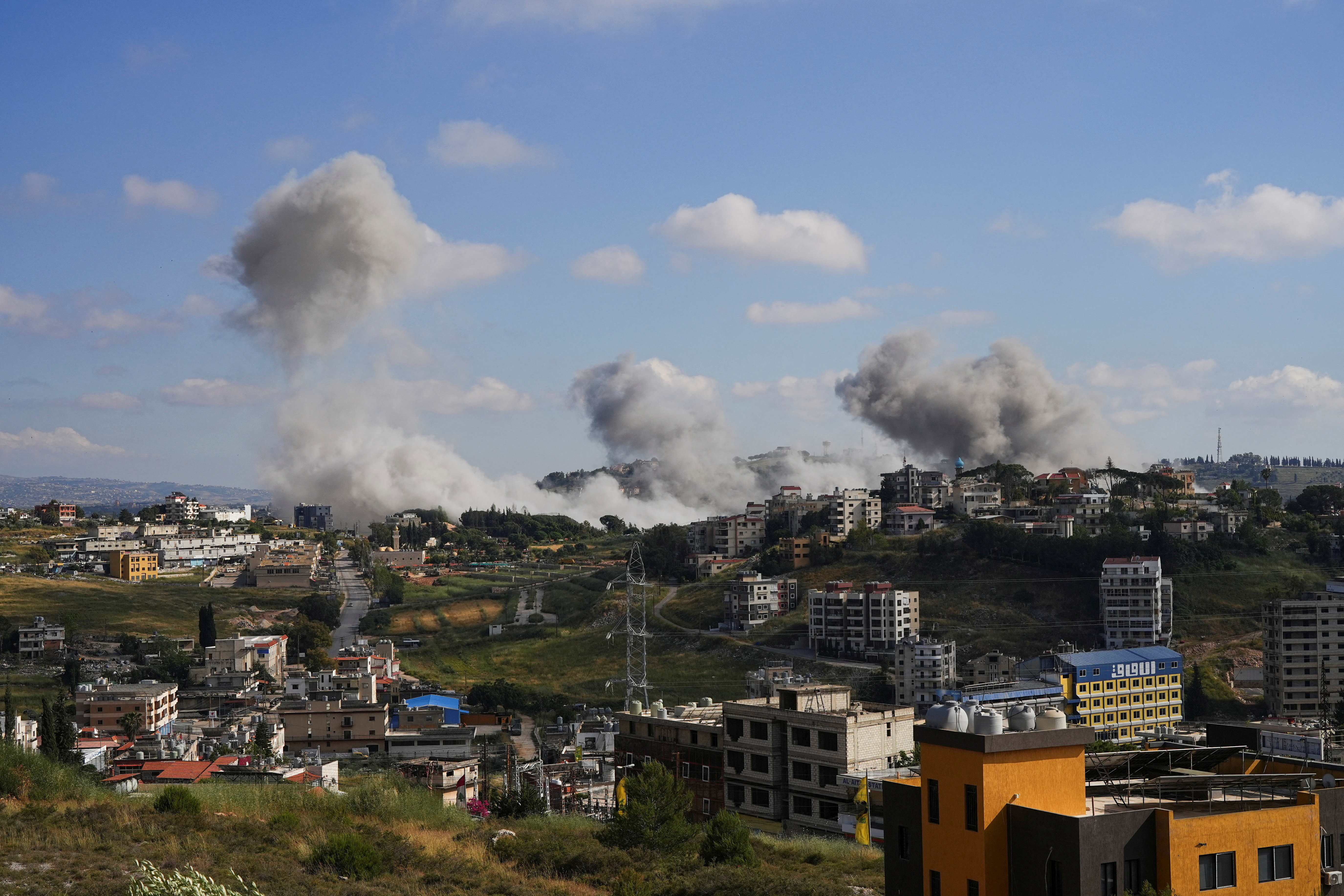 Plumes of smoke billow from southern Lebanon following Israeli strikes, as seen from Nabatieh, Lebanon, May 25, 2026. REUTERS/Stringer