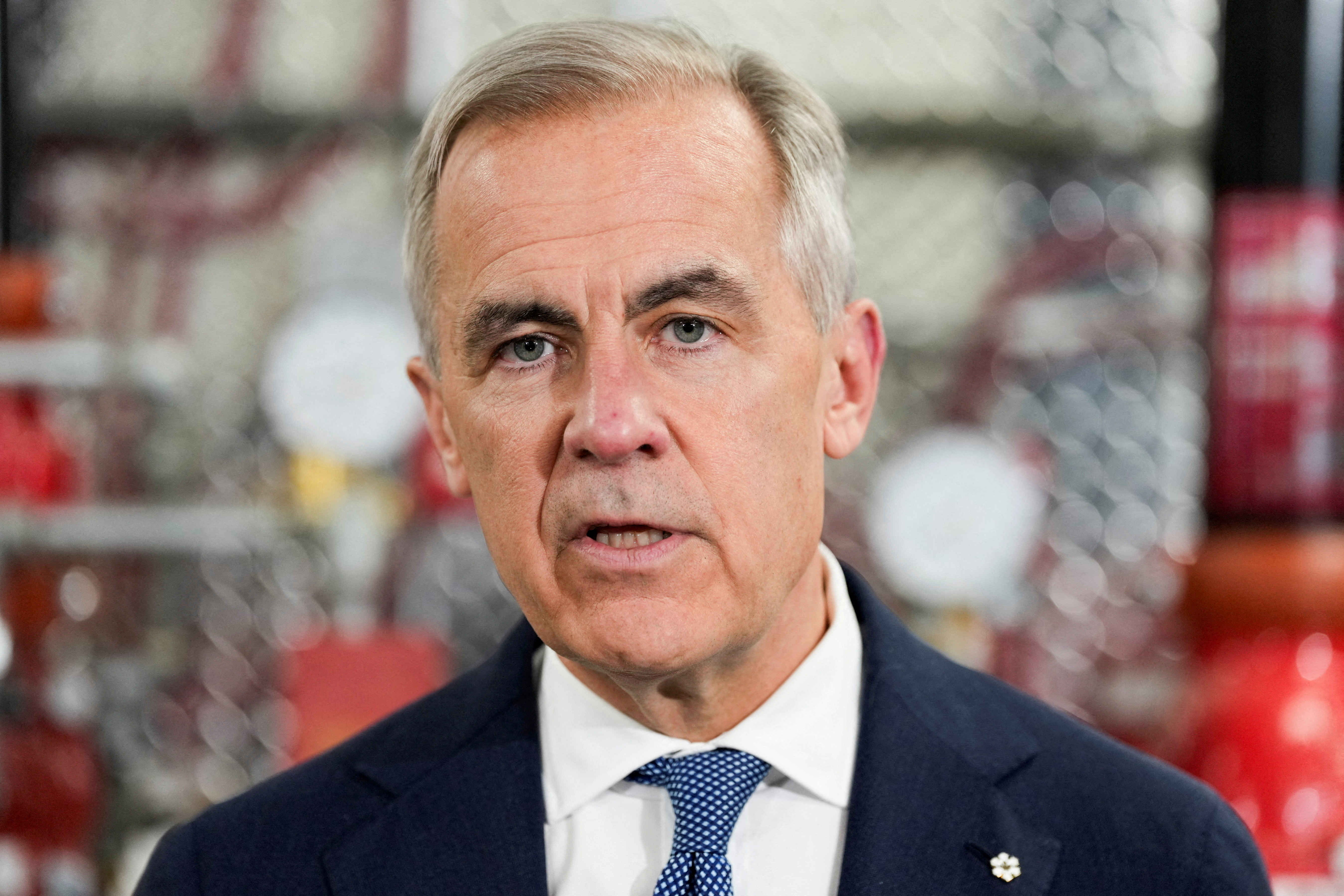 Canada's Prime Minister Mark Carney speaks as he meets unionized skilled trades workers