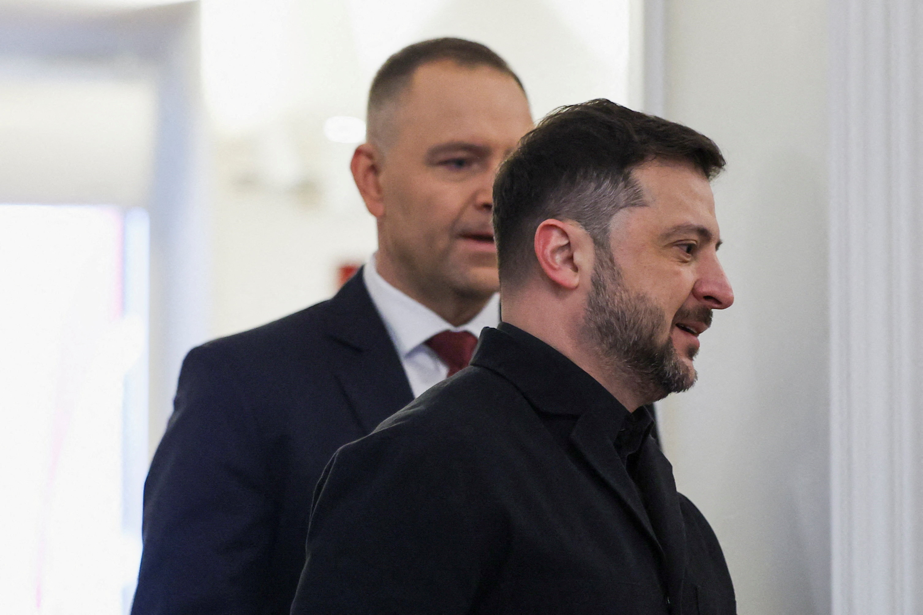 FILE PHOTO: Ukrainian President Volodymyr Zelenskiy walks with Polish President Karol Nawrocki as they meet at the Presidential Palace in Warsaw, Poland, December 19, 2025. REUTERS/Kacper Pempel/File Photo