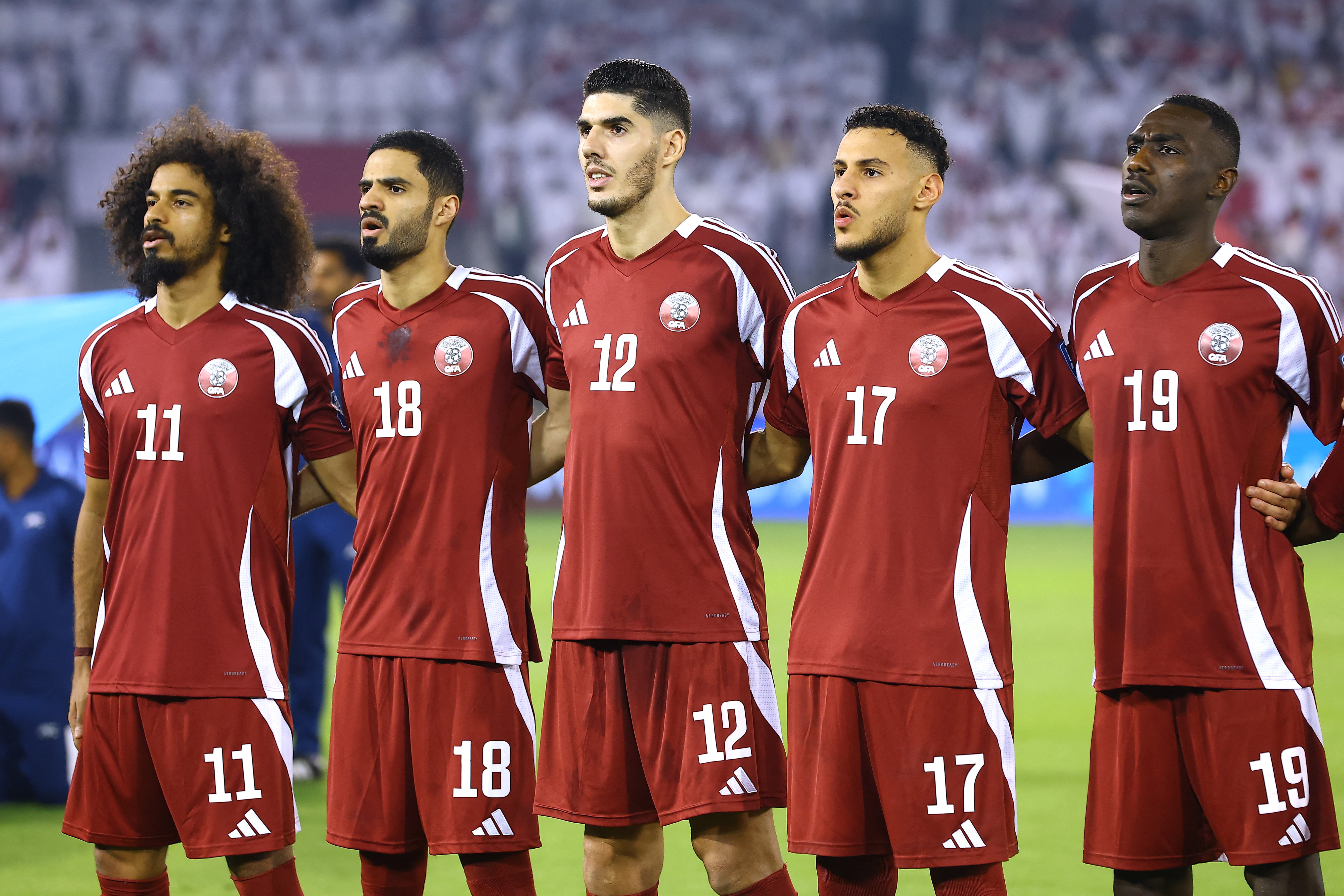 Soccer Football - FIFA World Cup - AFC Qualifiers - Group A - Qatar v United Arab Emirates - Jassim Bin Hamad Stadium, Doha, Qatar - October 14, 2025 Qatar's Akram Afif, Sultan Al-Brake, Karim Boudiaf, Mohamed Naceur Almanai and Almoez Ali during the national anthems before the match REUTERS/Ibraheem Al Omari