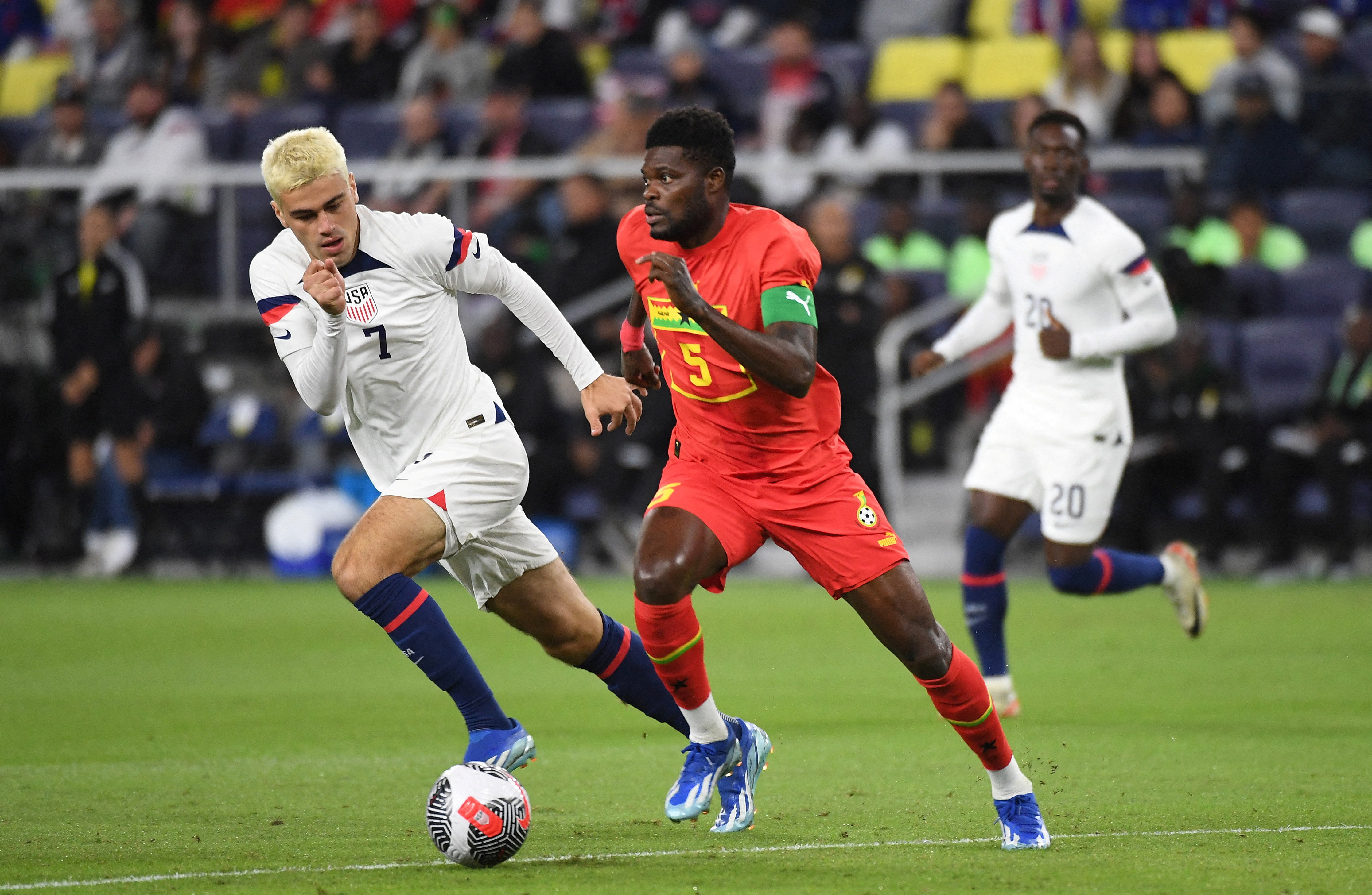FILE PHOTO: Oct 17, 2023; Nashville, Tennessee, USA; Ghana midfielder Thomas Partey (5) handles the ball against United States midfielder Gio Reyna (7) during the first half at GEODIS Park. Mandatory Credit: Christopher Hanewinckel-USA TODAY Sports/File Photo