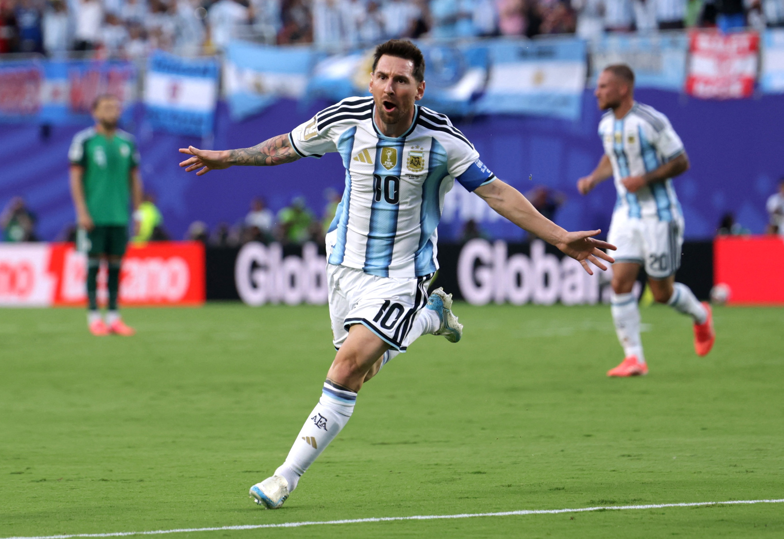 Argentina's Lionel Messi celebrates scoring their first goal