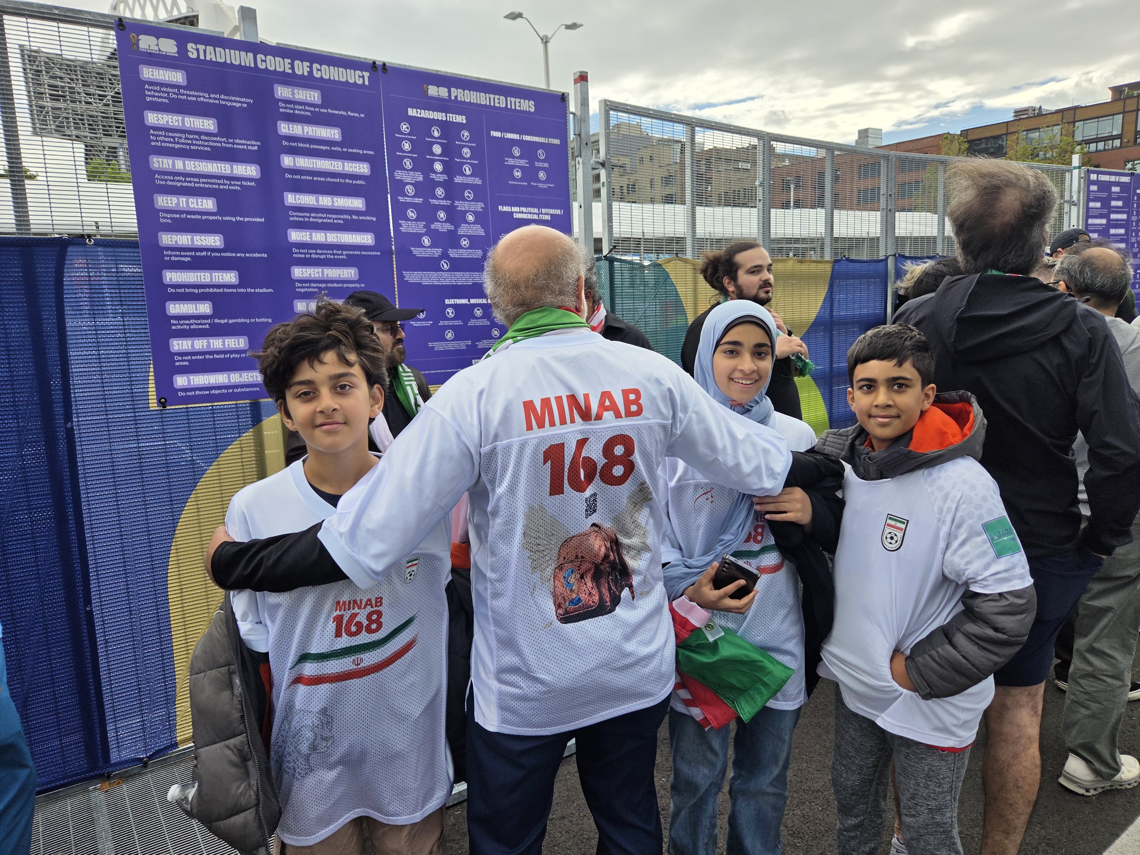Iranian fan Hameed with his children outside the Seattle Stadium, June 26