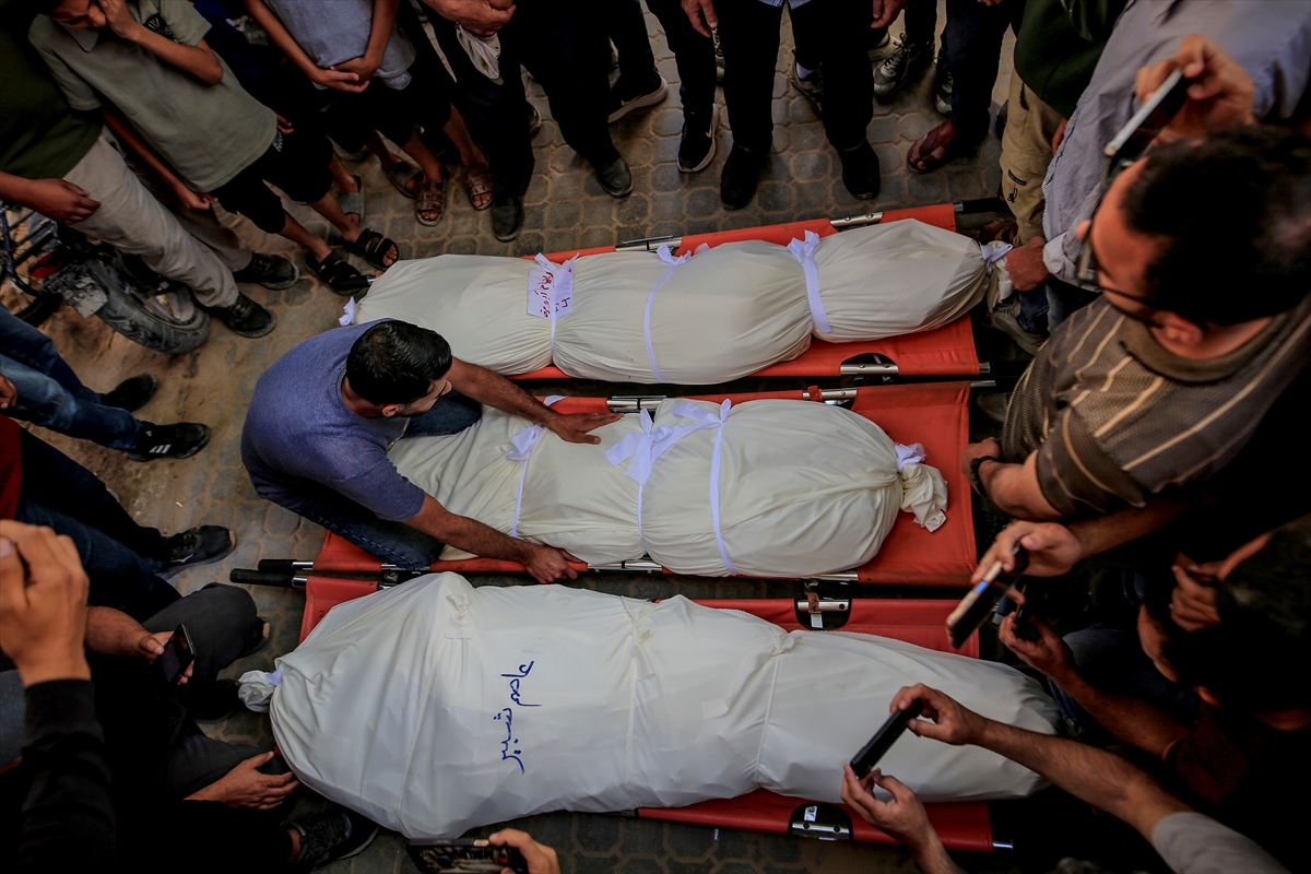 The bodies of Palestinians who lost their lives in overnight Israeli airstrikes are seen during a funeral ceremony in Gaza City, Palestine, on June 04, 2026. At least 10 Palestinians, including a mother, father and their three children from the same family, lost their lives and 20 others were injured in Israeli attacks that targeted different areas of the city despite a ceasefire. The victims were brought from Al-Shifa Hospital for burial following funeral prayers. Photojournalist:Saeed M. M. T. Jaras