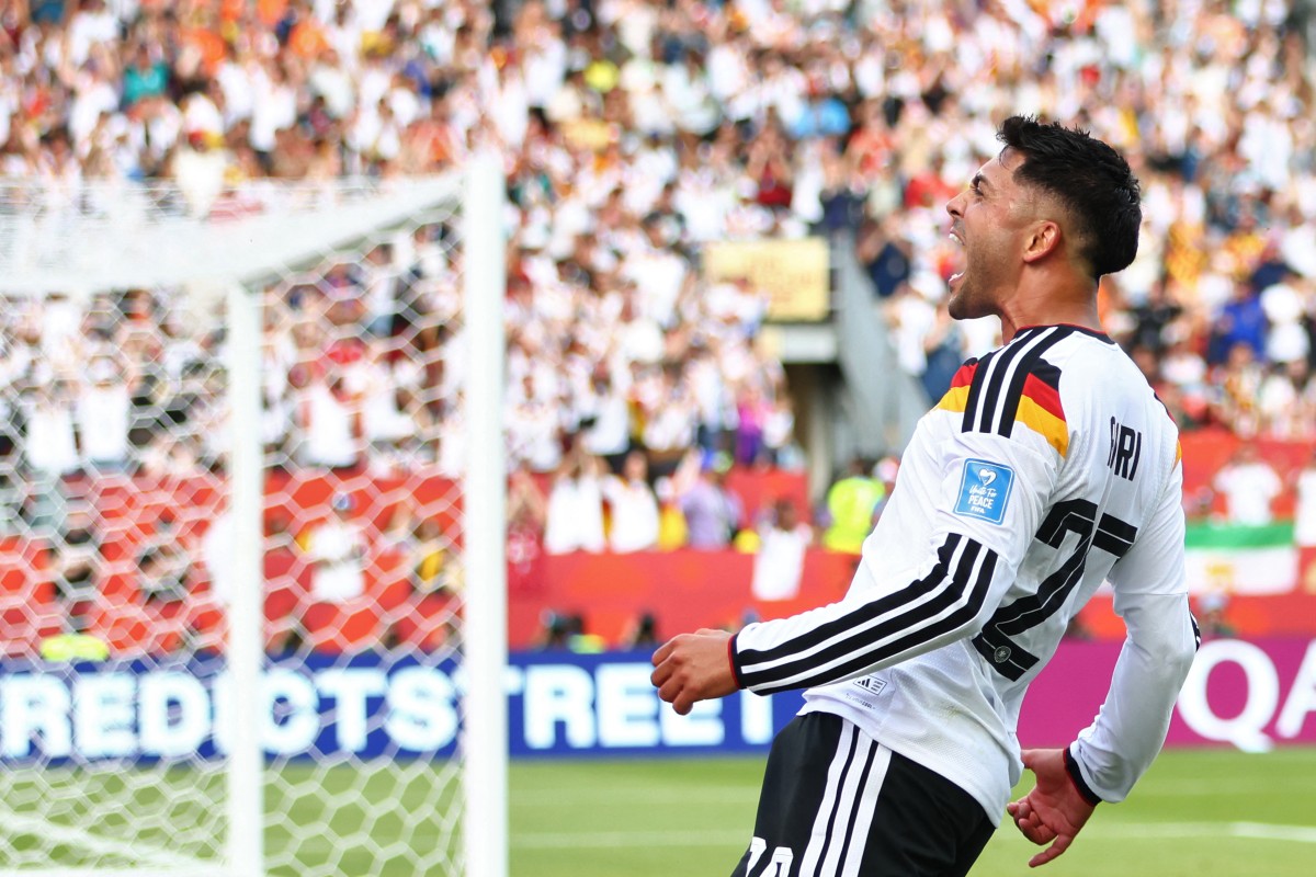 Germany's midfielder #20 Nadiem Amiri celebrates his team's second goal during the 2026 World Cup Group E football match between Germany and Ivory Coast
