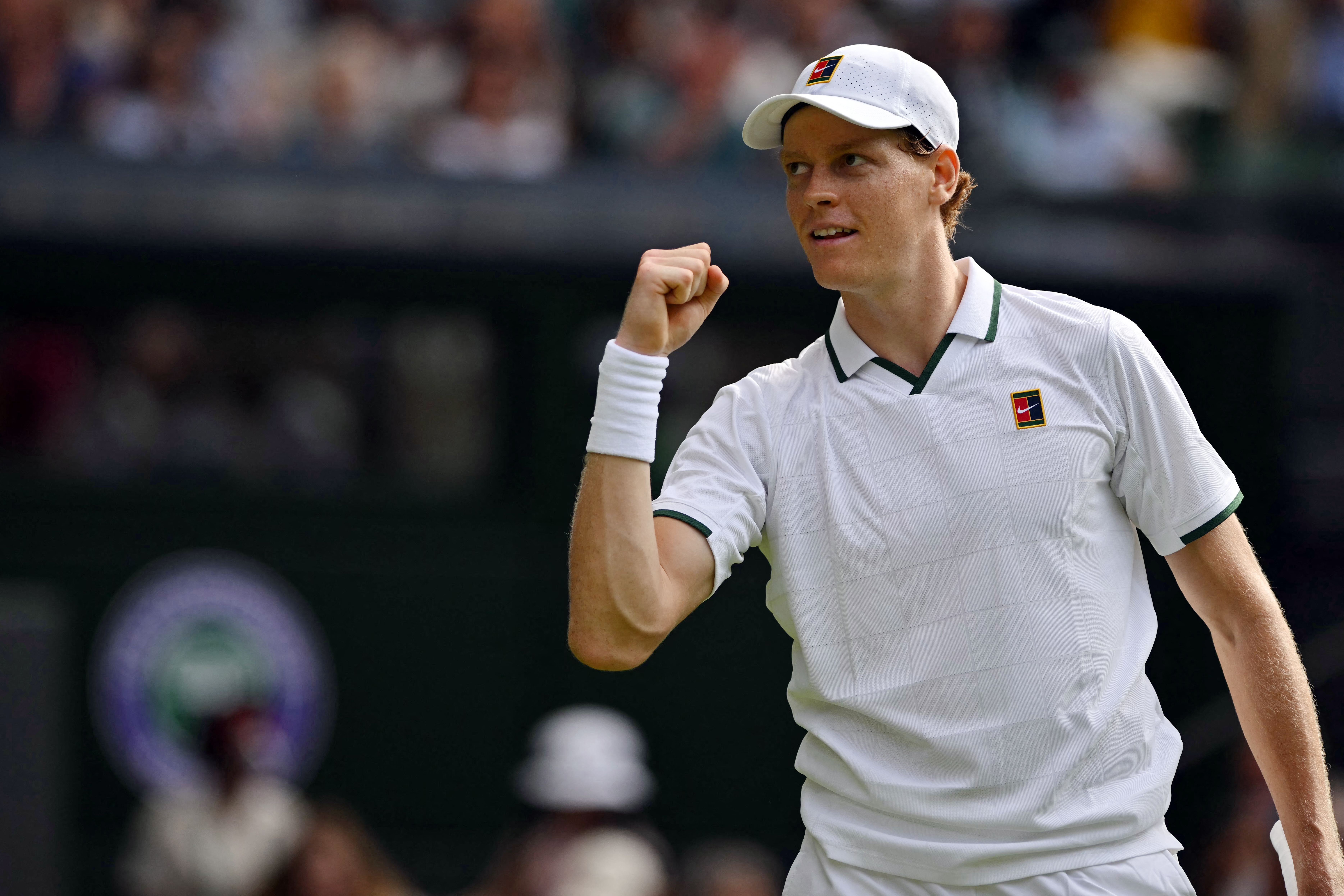 Italy's Jannik Sinner celebrates beating Serbia's Miomir Kecmanovic during their men's singles first round tennis match on the first day of the 2026 Wimbledon Championships at The All England Lawn Tennis and Croquet Club in Wimbledon, southwest London, on June 29, 2026. (Photo by Glyn KIRK / AFP) / RESTRICTED TO EDITORIAL USE