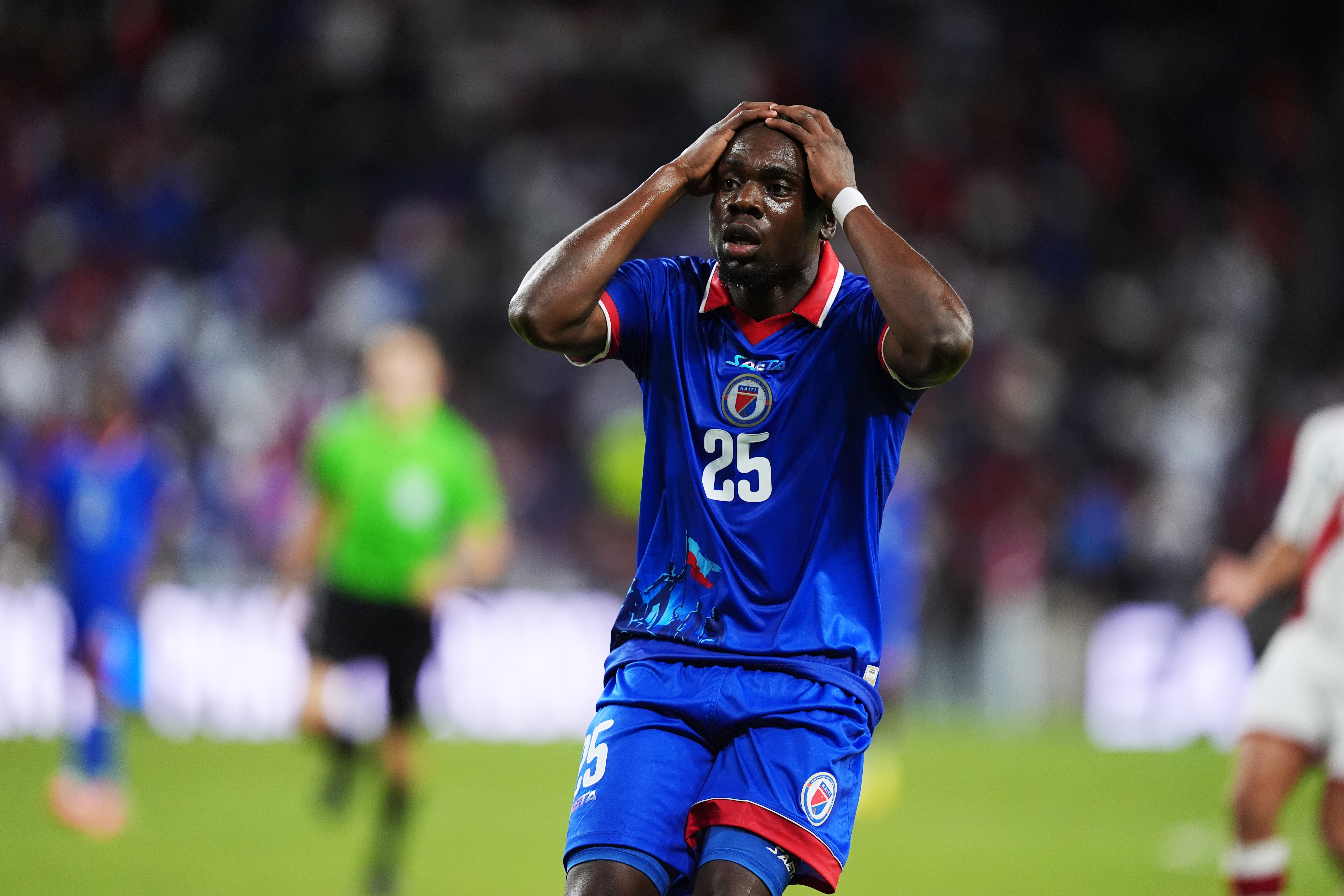 Midfielder Dominique Simon dressed in the Haiti kit, which the Caribbean nation was asked to alter over war imagery