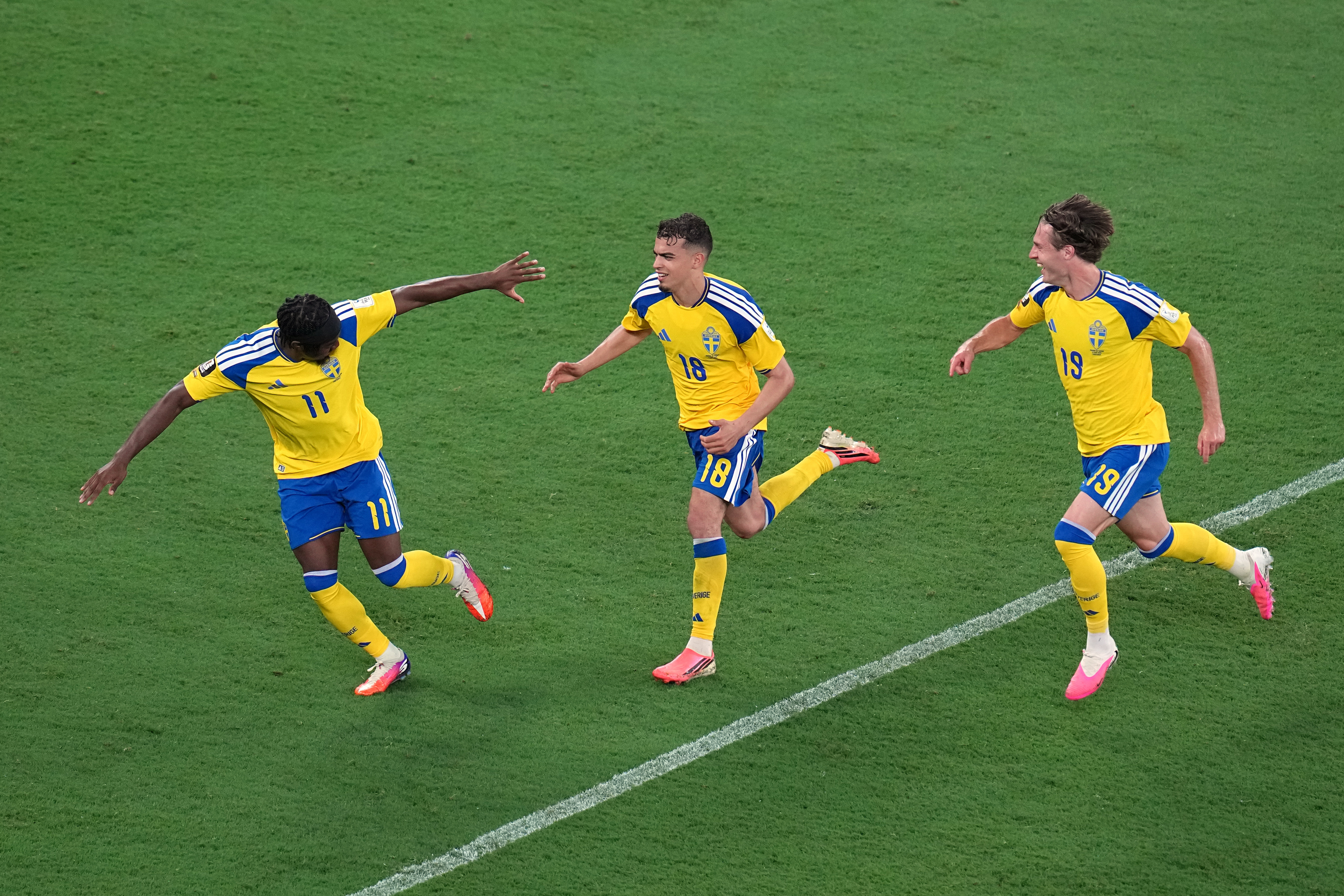 Sweden's Yasin Ayari (18) celebrates with Anthony Elanga (11) and Mattias Svanberg (19) after scoring their fifth goal during the World Cup Group F soccer match between Sweden and Tunisia in Guadalupe, near Monterrey, Mexico, Sunday, June 14, 2026. (AP Photo/Dolores Ochoa)