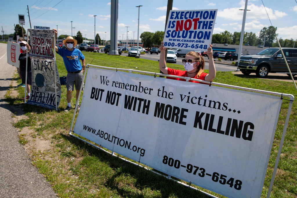 Kyle Rubin of Columbus, Ohio, protests against the death penalty in Terre Haute, Indiana, on July 17, 2020