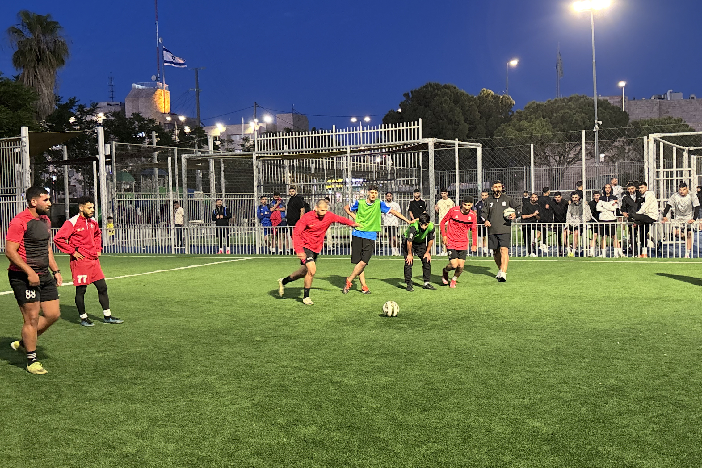 Eid tournament with several national team players with Israeli flag from police HQ