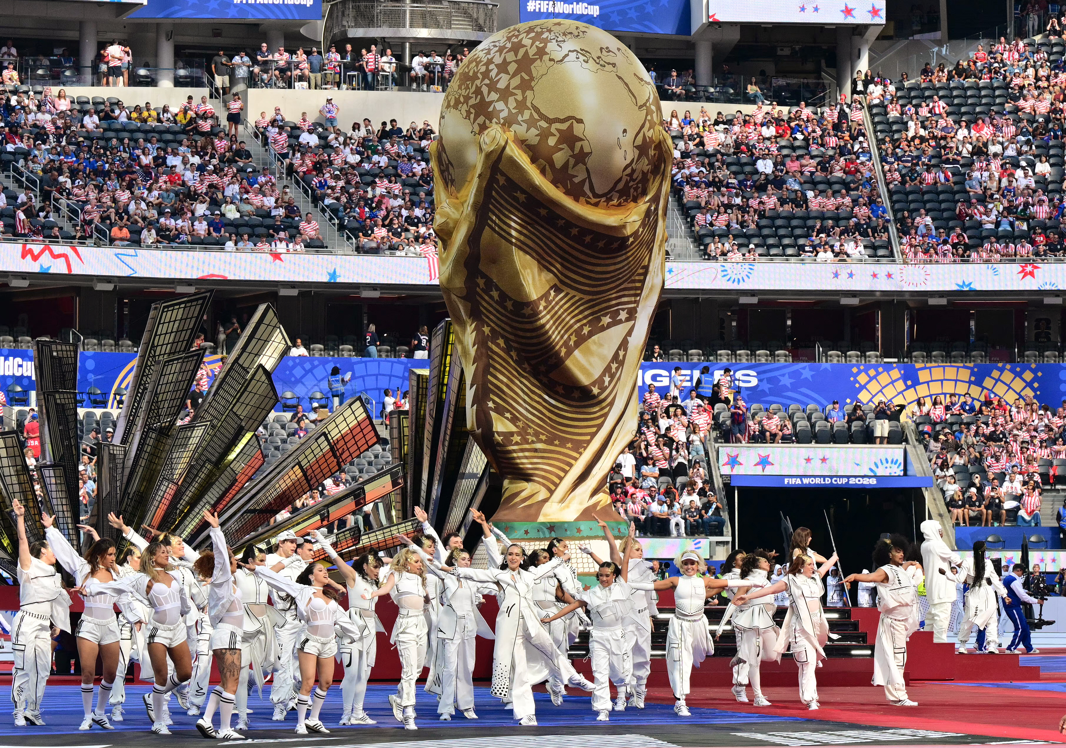 TOPSHOT - Artists perform during the opening ceremony of the 2026 World Cup football tournament ahead of the Group D football match between USA and Paraguay at the Los Angeles Stadium in Inglewood on June 12, 2026. (Photo by Frederic J. BROWN / AFP)