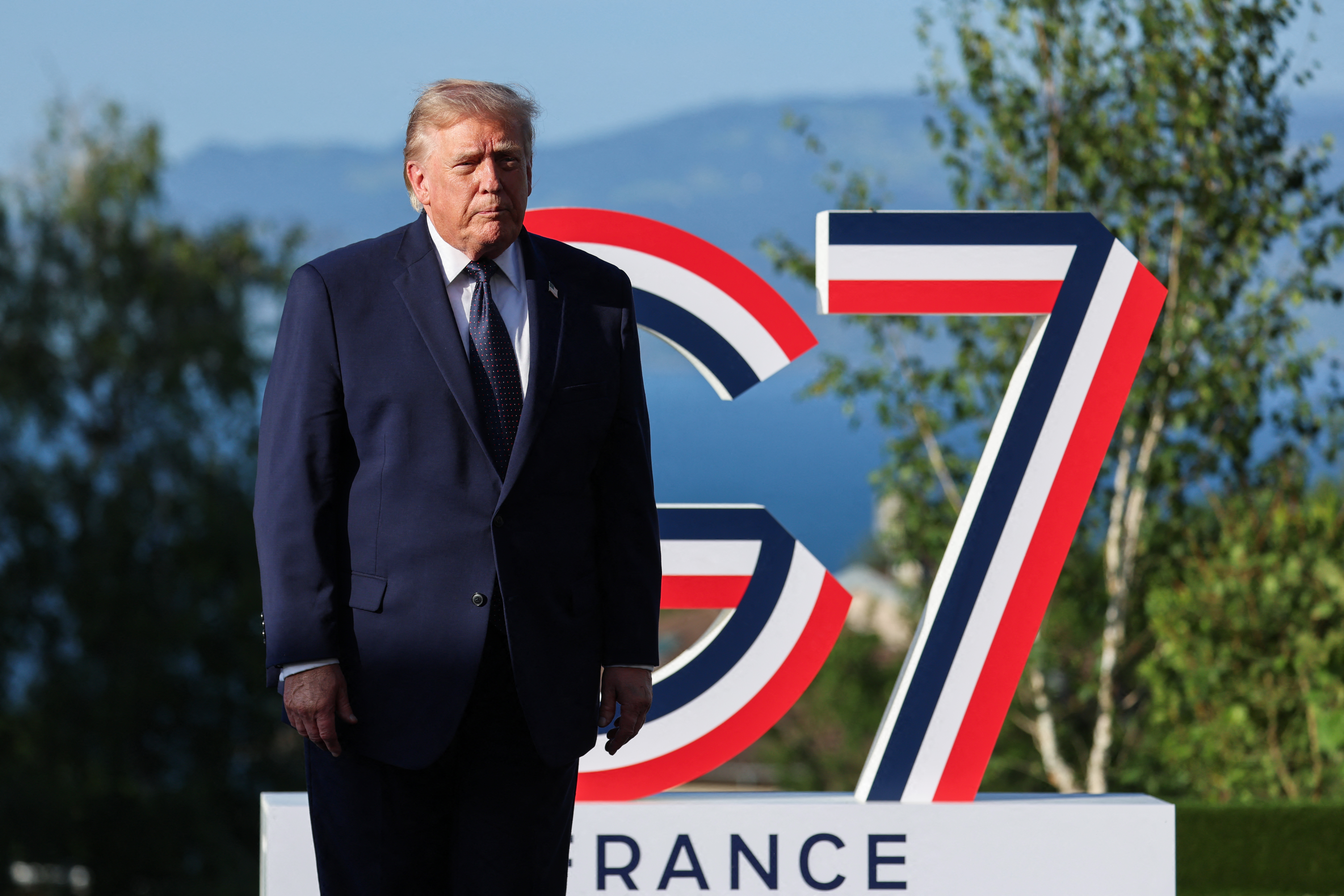 US President Donald Trump arrives for the official greeting during the G7 summit, in Evian, eastern France, on June 15, 2026.