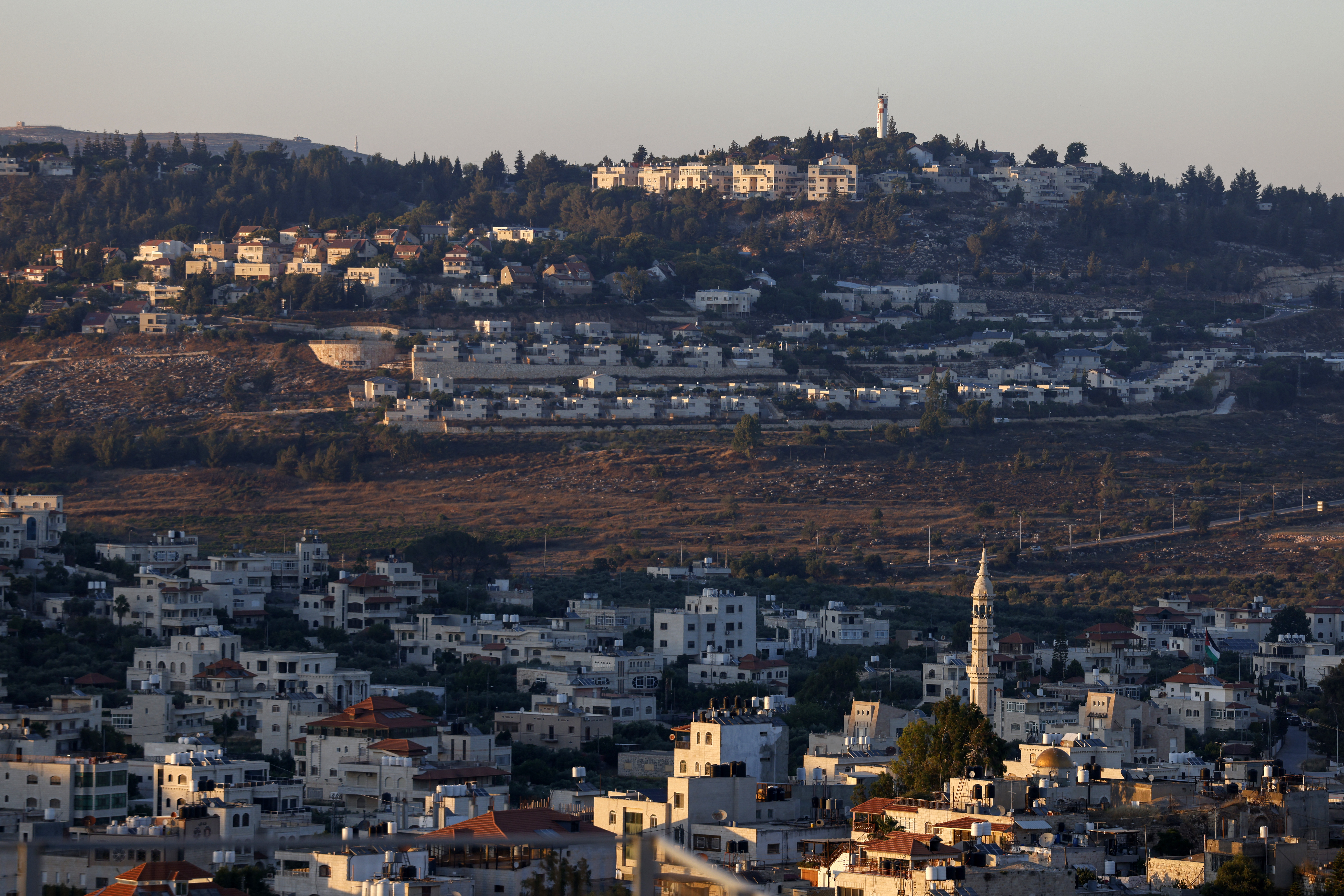 General view of the Palestinian village of Turmus Ayya, north of Ramallah in the occupied West Bank, with the Israeli settlement of Shilo visible in the background, on June 28, 2026.