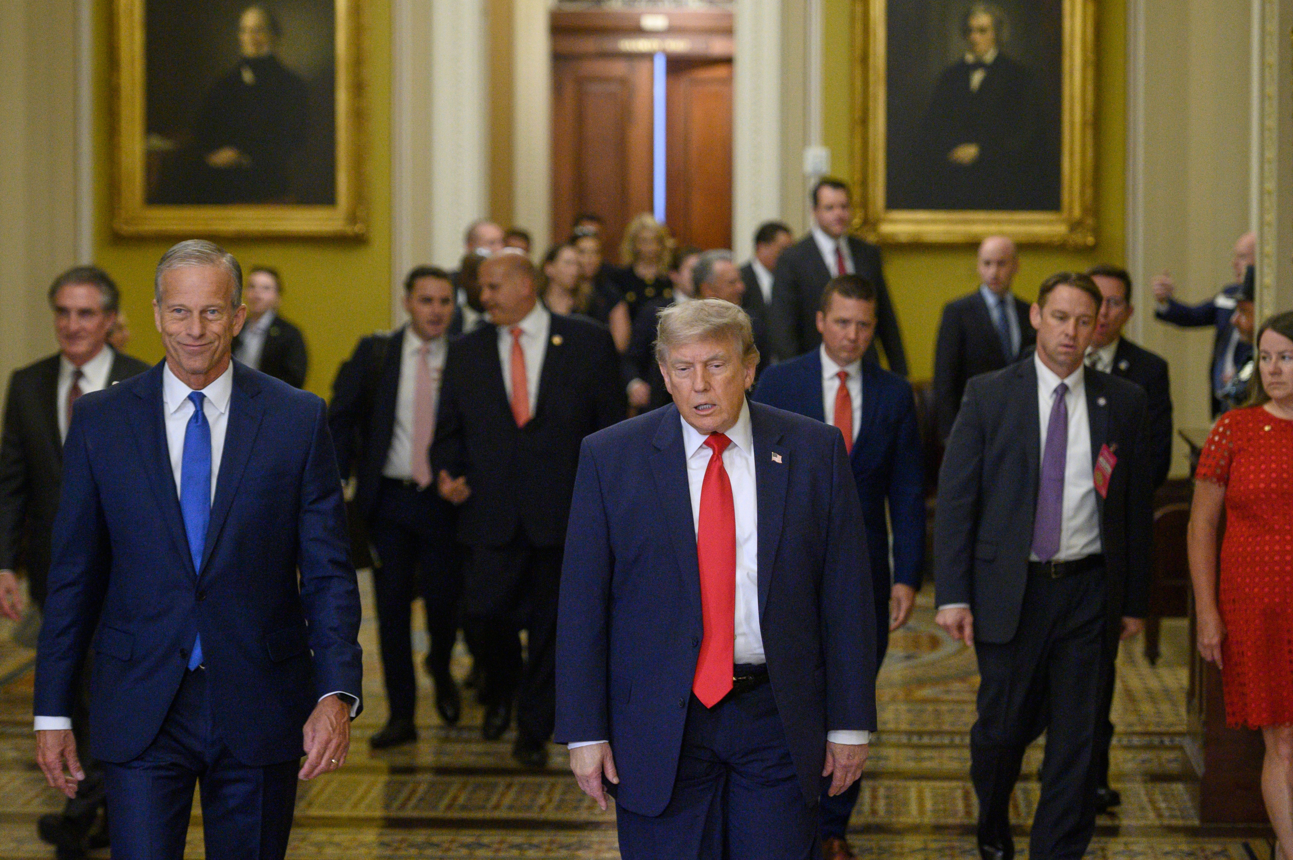 Senate Majority Leader John Thune, left, and President Donald Trump arrive for a lunch at the Capitol on June 24, 2026, at which Trump berated Senate Republicans for passing the war powers resolution