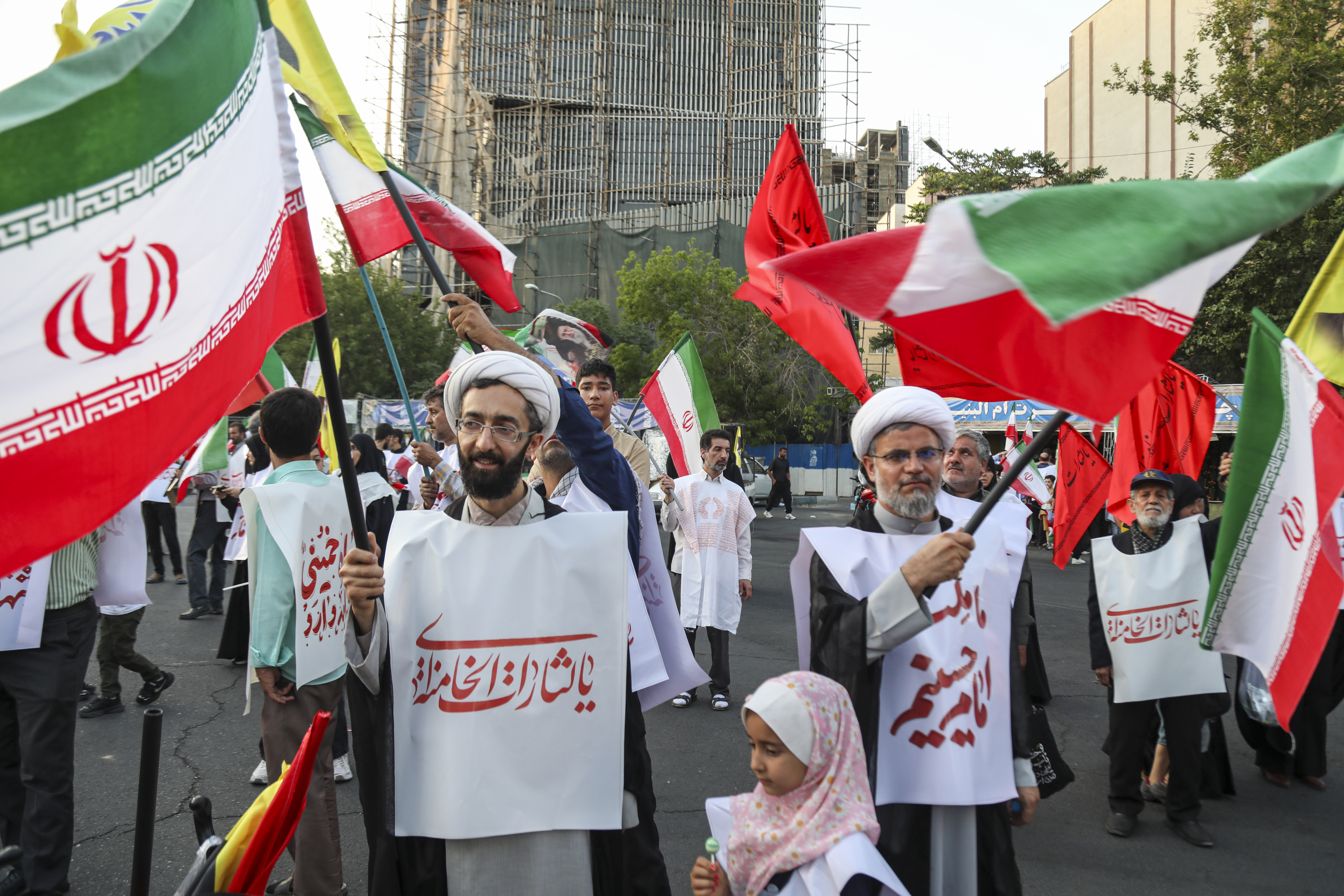 TEHRAN, IRAN - JUNE 12: People from Tehran province gather in support and allegiance to Iranian Supreme Leader Mojtaba Khamenei, while holding Iranian flags and images of both the new and former leaders of Iran, on June 12, 2026 at Palestine Square in Tehran, Iran. (Photo by Majid Saeedi/Getty Images)
