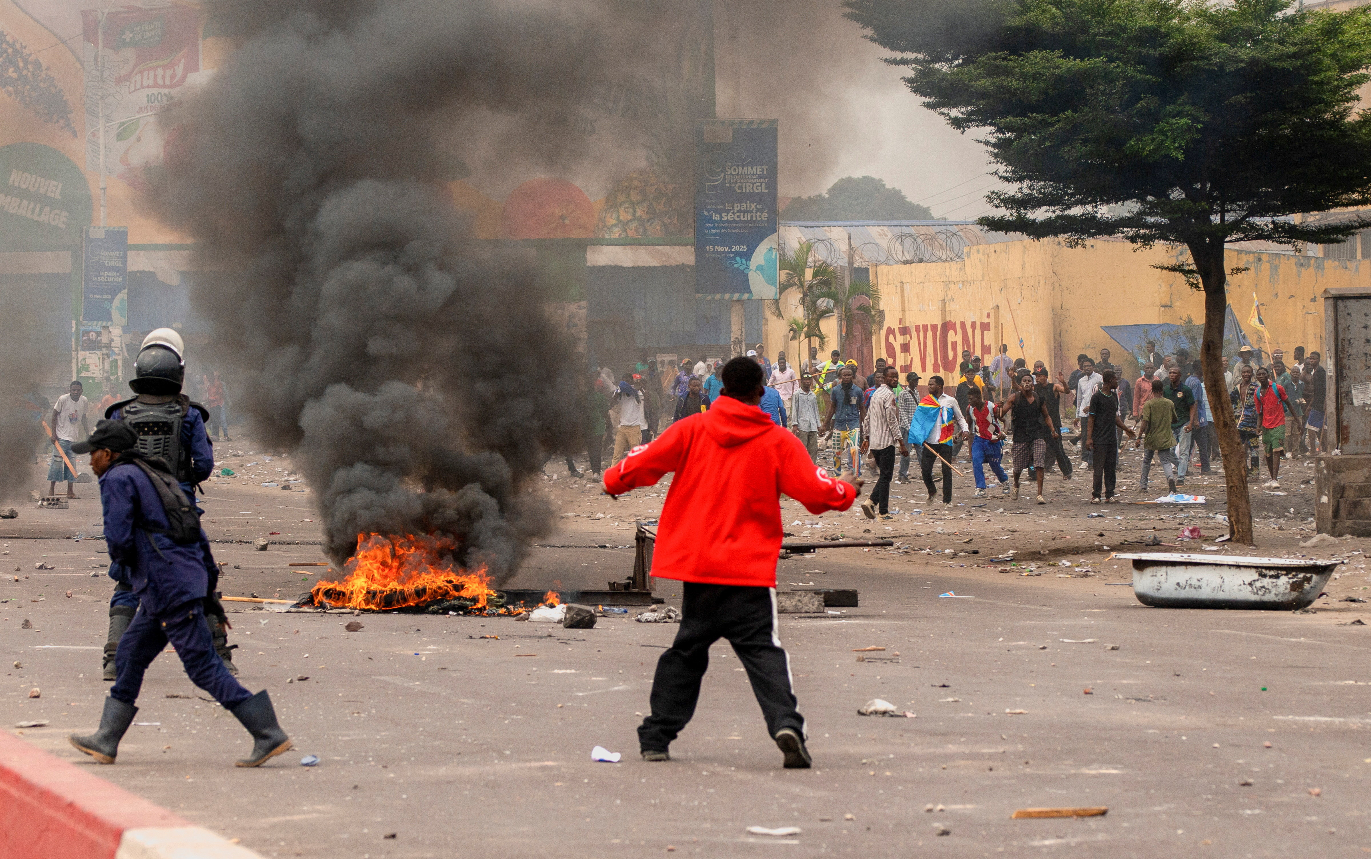 A fire burns during protests near the parliament building in Kinshasa, Democratic Republic of Congo, June 12, 2026. REUTERS/Aristote Lokinda