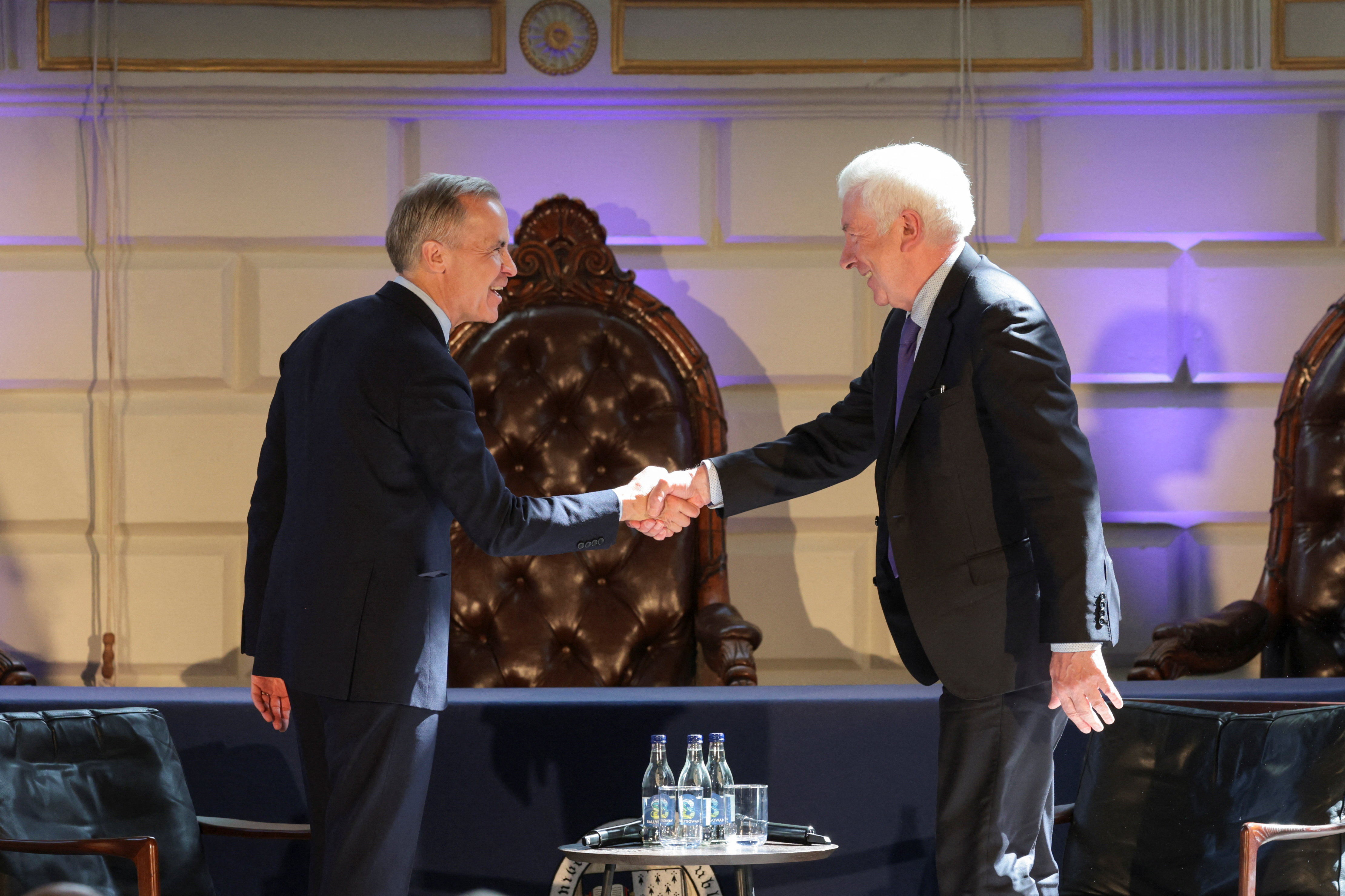 Canadian Prime Minister Mark Carney shakes hands with former Labour Party politician Alex White at Trinity College Dublin in Dublin, Ireland, June 13, 2026. REUTERS/Emilija Jefremova/Pool