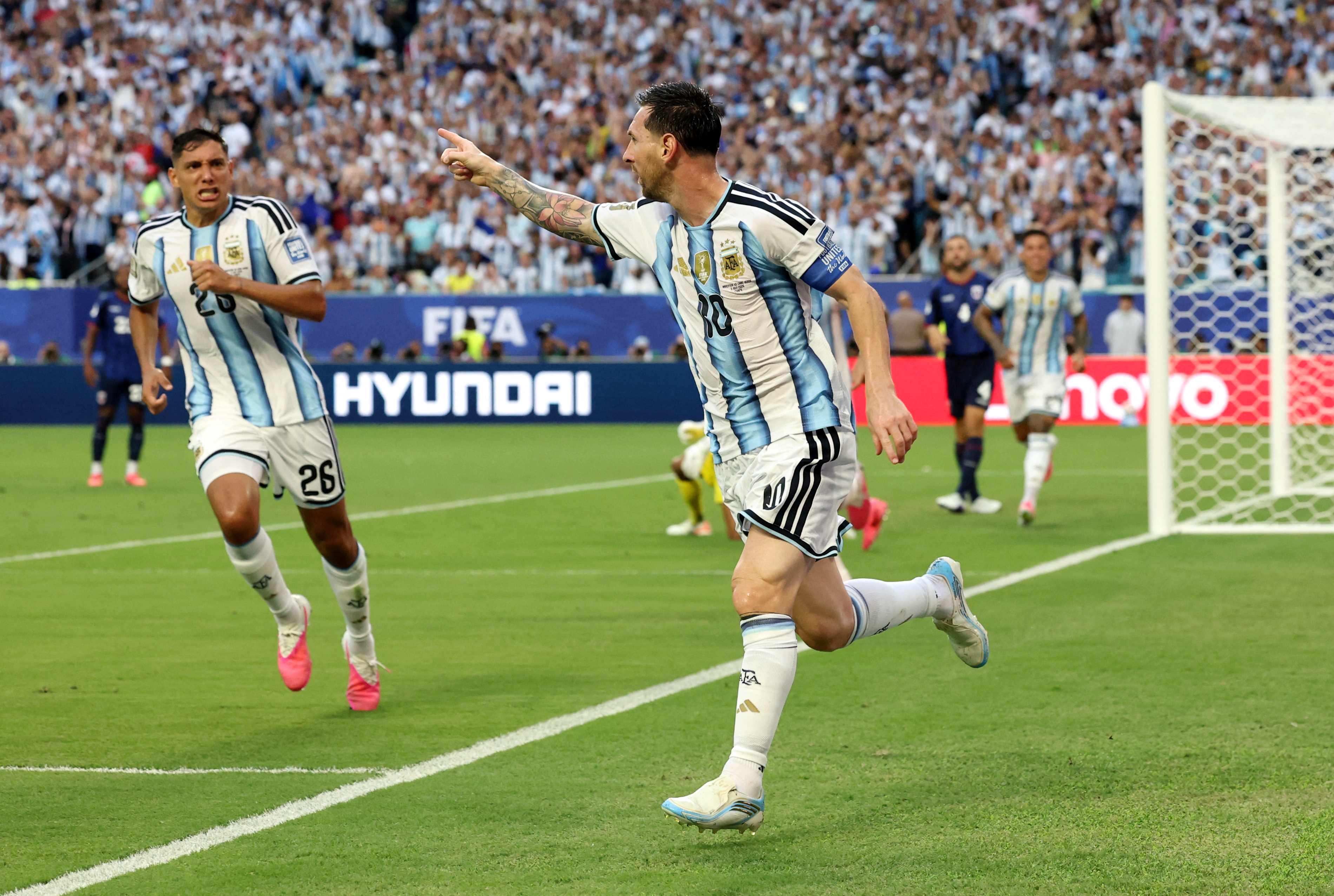 Argentina's Lionel Messi scores their first goal