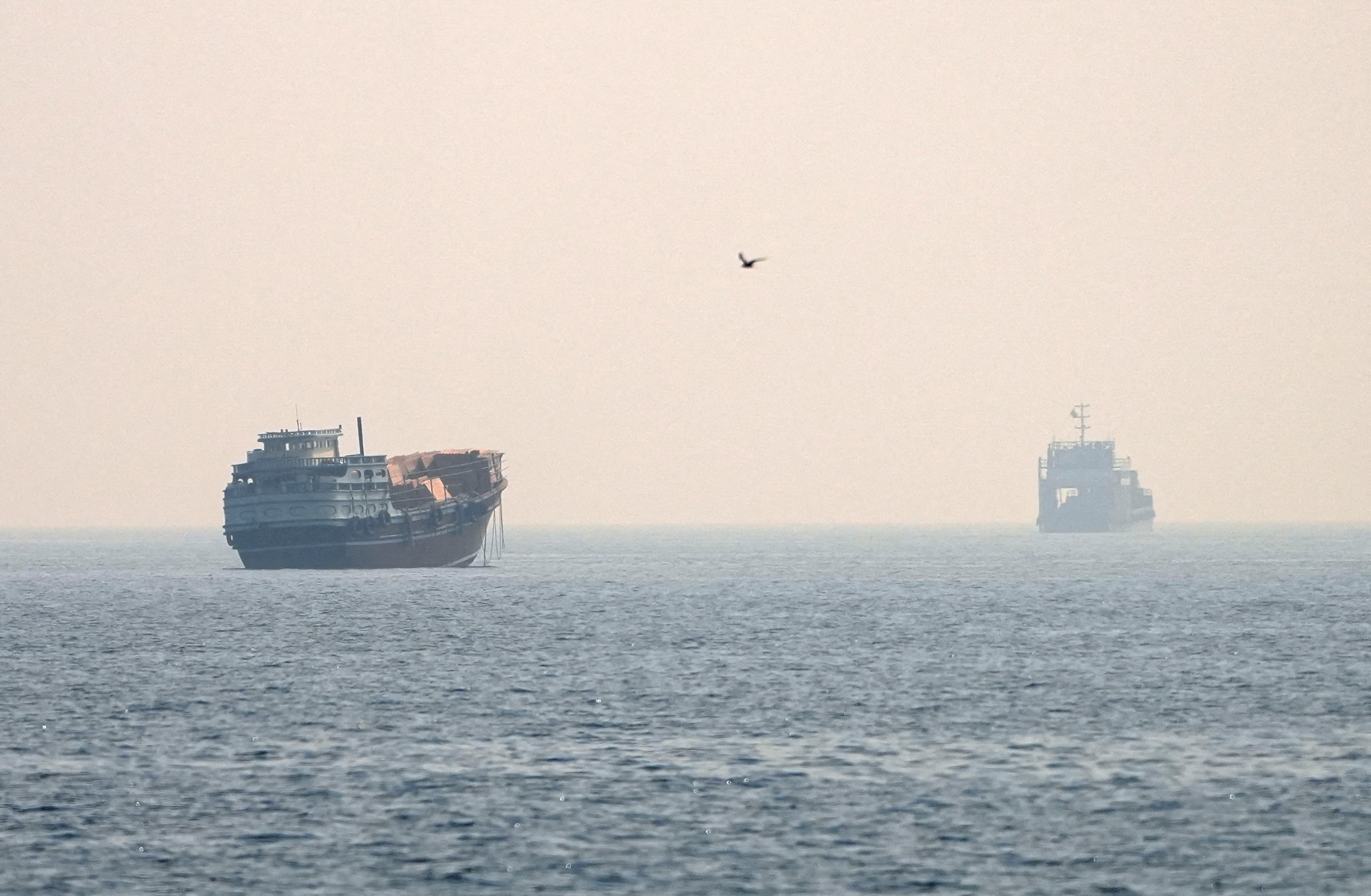 Vessels are seen at sea.