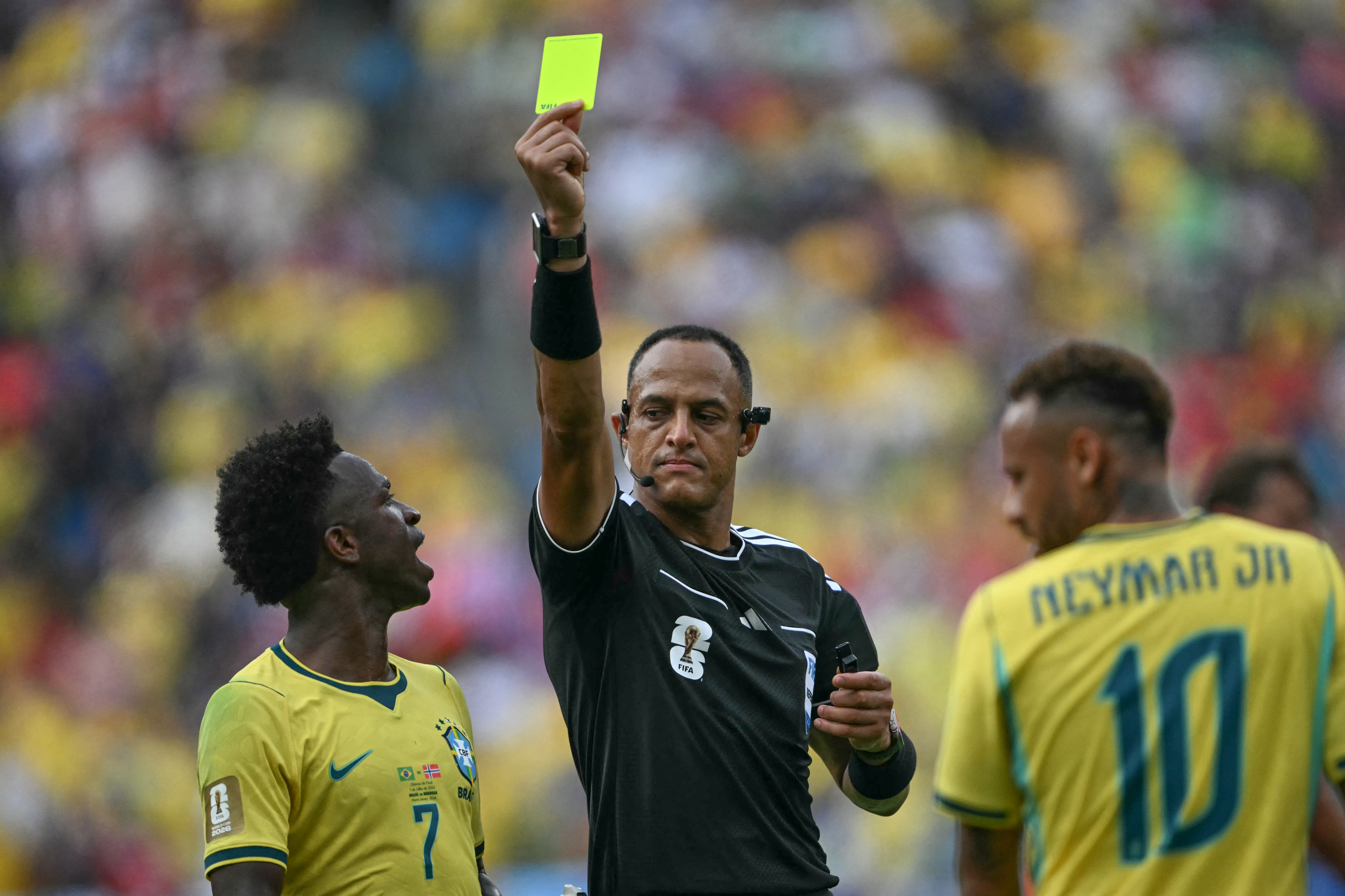 US referee Ismail Elfath shows a yellow card to Brazil's forward #10 Neymar (out of frame) during the 2026 World Cup round of 16 football match between Brazil and Norway at the New York/New Jersey Stadium in East Rutherford on July 5, 2026. (Photo by MAURO PIMENTEL / AFP)