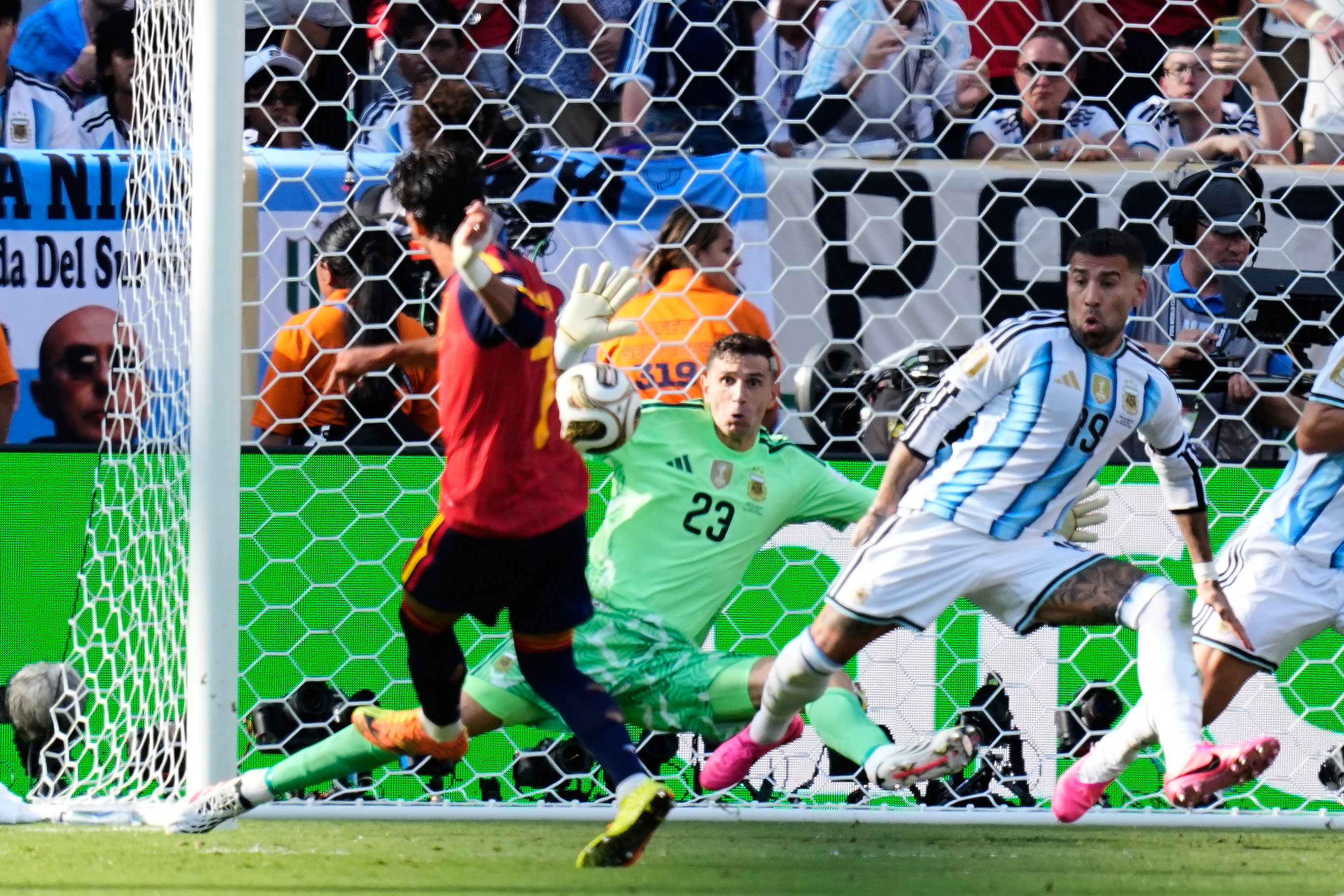 Spain’s Ferran Torres scores the winning goal past Argentina goalkeeper Emiliano Martinez