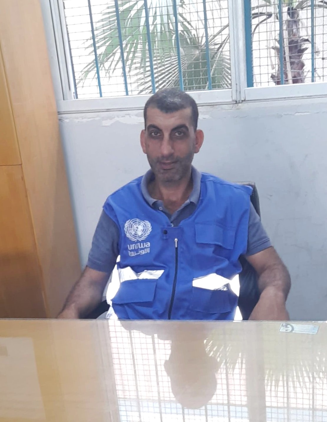Akram Abu Jiab, head of Qutoof Al-Khair Foundation, which supports pregnant women and newborns by providing vitamins and nutritional supplements for mothers, as well as medicines and medical supplies for children. [Eman Abu Zayed/ Al Jazeera]