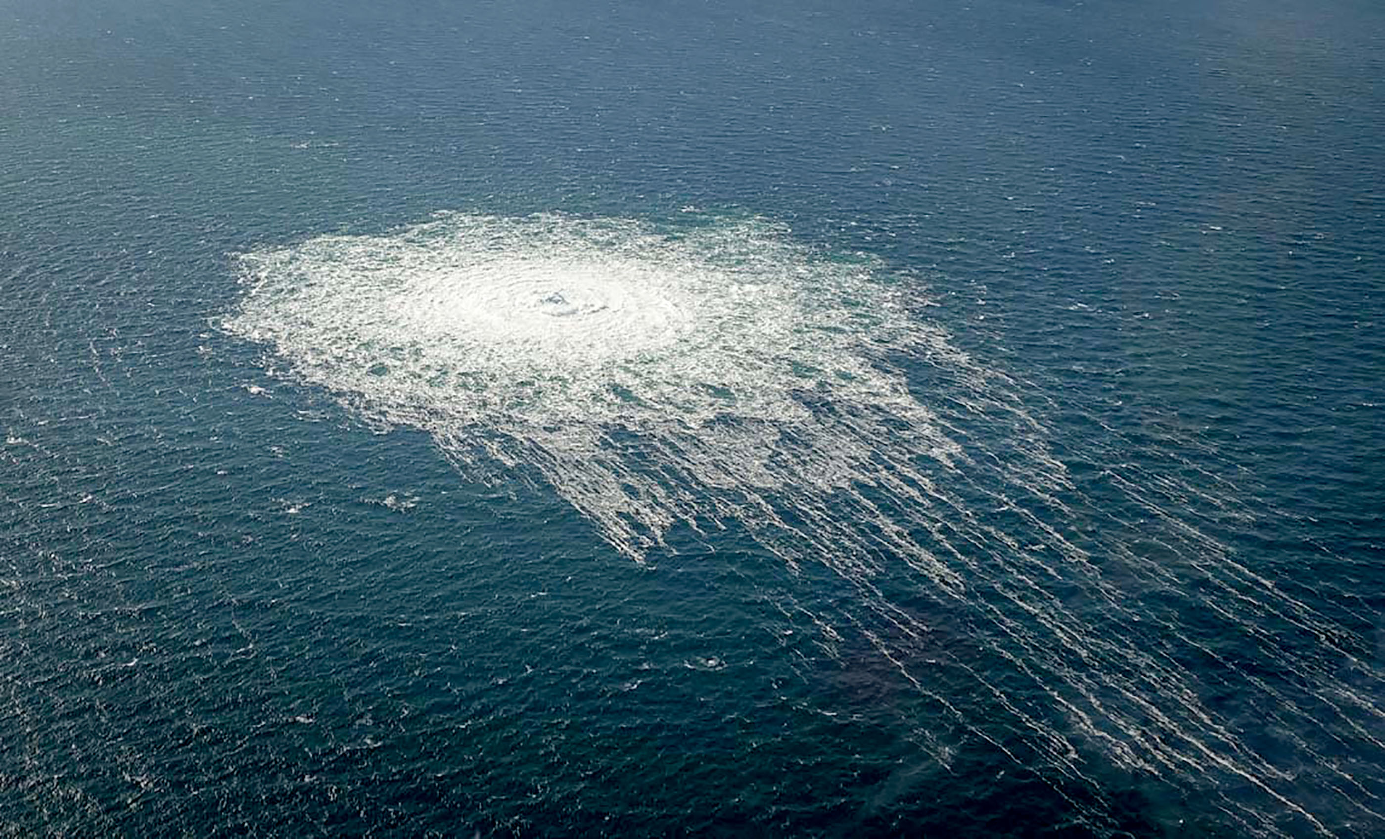 (FILES) This handout picture released on September 27, 2022 by the Danish Defence Command shows the gas leak at the Nord Stream 2 gas pipeline as it is seen from the Danish Defence's F-16 rejection response off the Danish Baltic island of Bornholm, south of Dueodde.