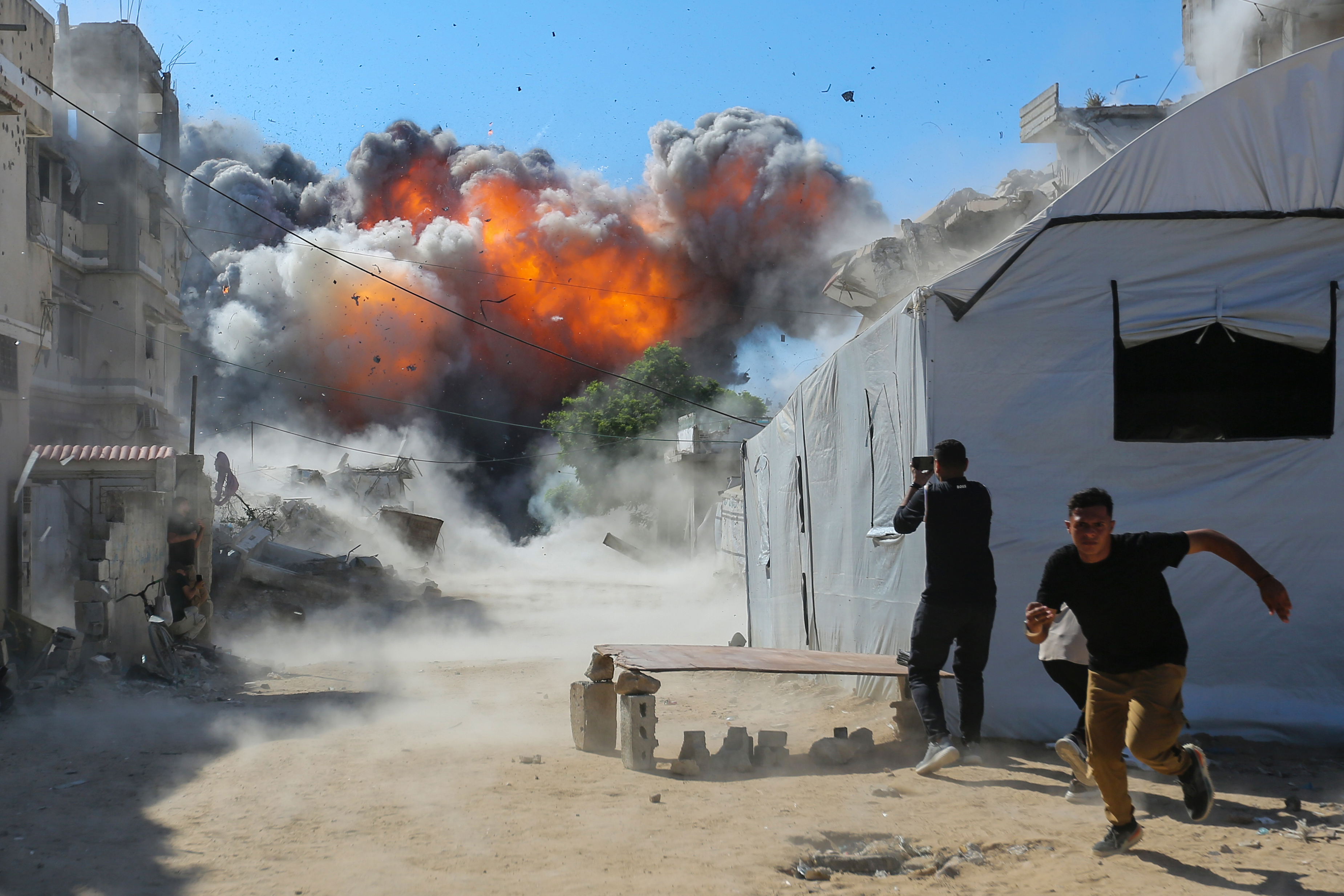 GAZA CITY, GAZA - JULY 12: (EDITOR'S NOTE: Alternative crop of image #2285764770) Smoke from an explosion can be seen after an Israeli attack on July 12, 2026 in Gaza City, Gaza. An Israeli attack on an industrial area west of Gaza City has injured a number of Palestinians, according to witnesses. Israel has continued to bomb Gaza despite the US-brokered ceasefire deal, accusing Hamas of rearming and rebuilding its forces. (Photo by Ahmad Hasaballah/Getty Images)