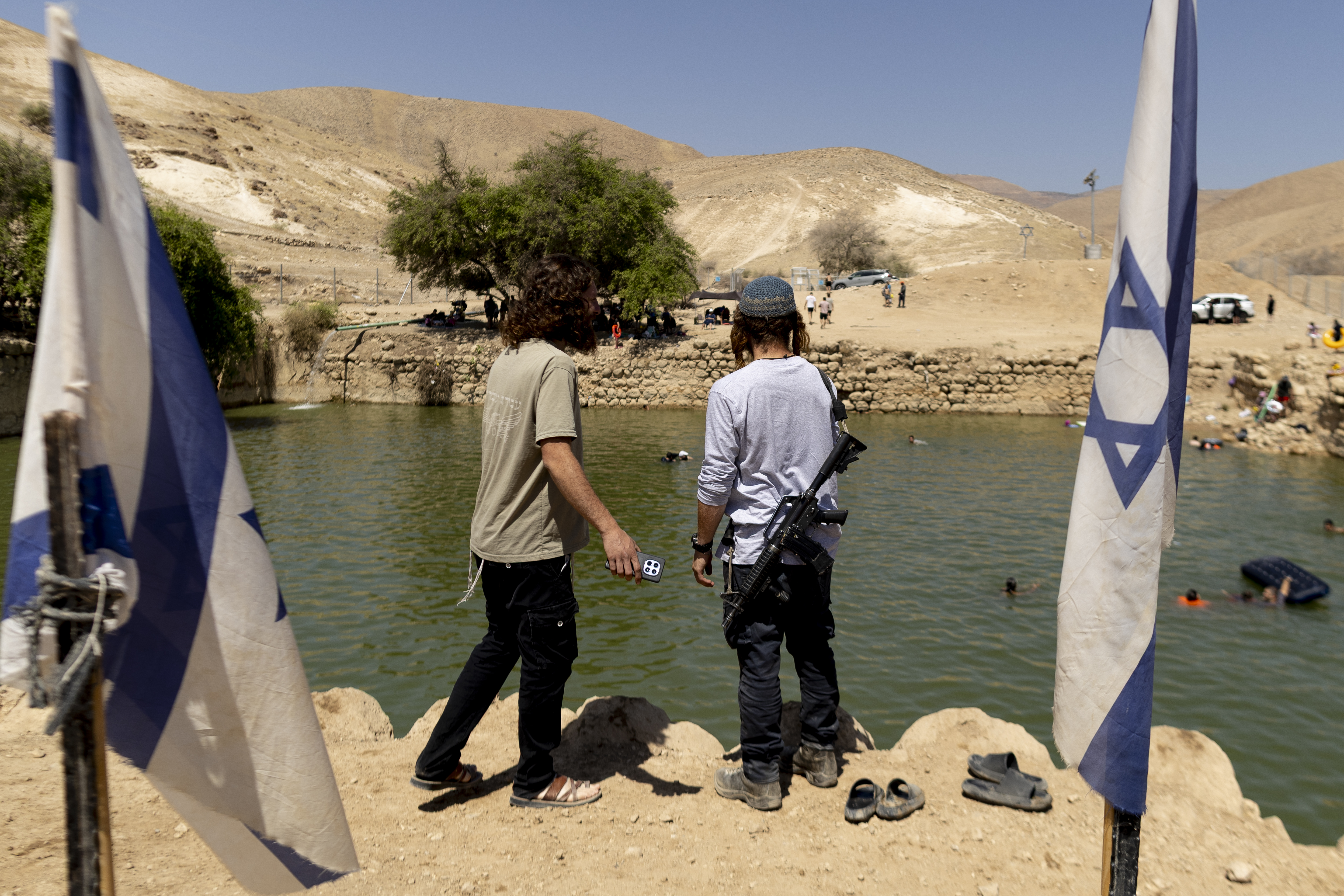 PETZA'EL, WEST BANK - JULY 31: Jewish-Israelis hang out at the ancient archaeological site known as Herod's Pool on July 31, 2026 near the Israeli settlement of Petza'el, West Bank. Far-right Israeli Finance Minister Bezalel Smotrich has announced plans to invest three million shekels (USD $978,792) to develop an archeological site known by Israeli settlers as "Herod's Pool," located on privately-owned Palestinian land near Fasayel, in the Jordan Valley area of the occupied West Bank. The site was recently seized by settlers and made into an informal tourist attraction, filling the pool with water allegedly diverted from Palestinian lands, without permission from the Civil Administration authorities. The announcement of the plan comes after Smotrich threatened in May to seize the historic Solomon's Pools, near Bethlehem, which are also under Palestinian control. (Photo by Amir Levy/Getty Images)