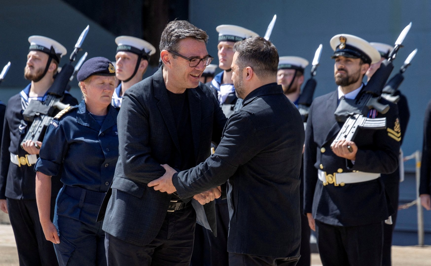 British Prime Minister Andy Burnham welcomes the President of Ukraine, Volodymyr Zelenskiy, during their visit to Portsmouth Naval Base to meet UK and Ukrainian troops, July 27, 2026. [Simon Jones/Pool/Reuters]