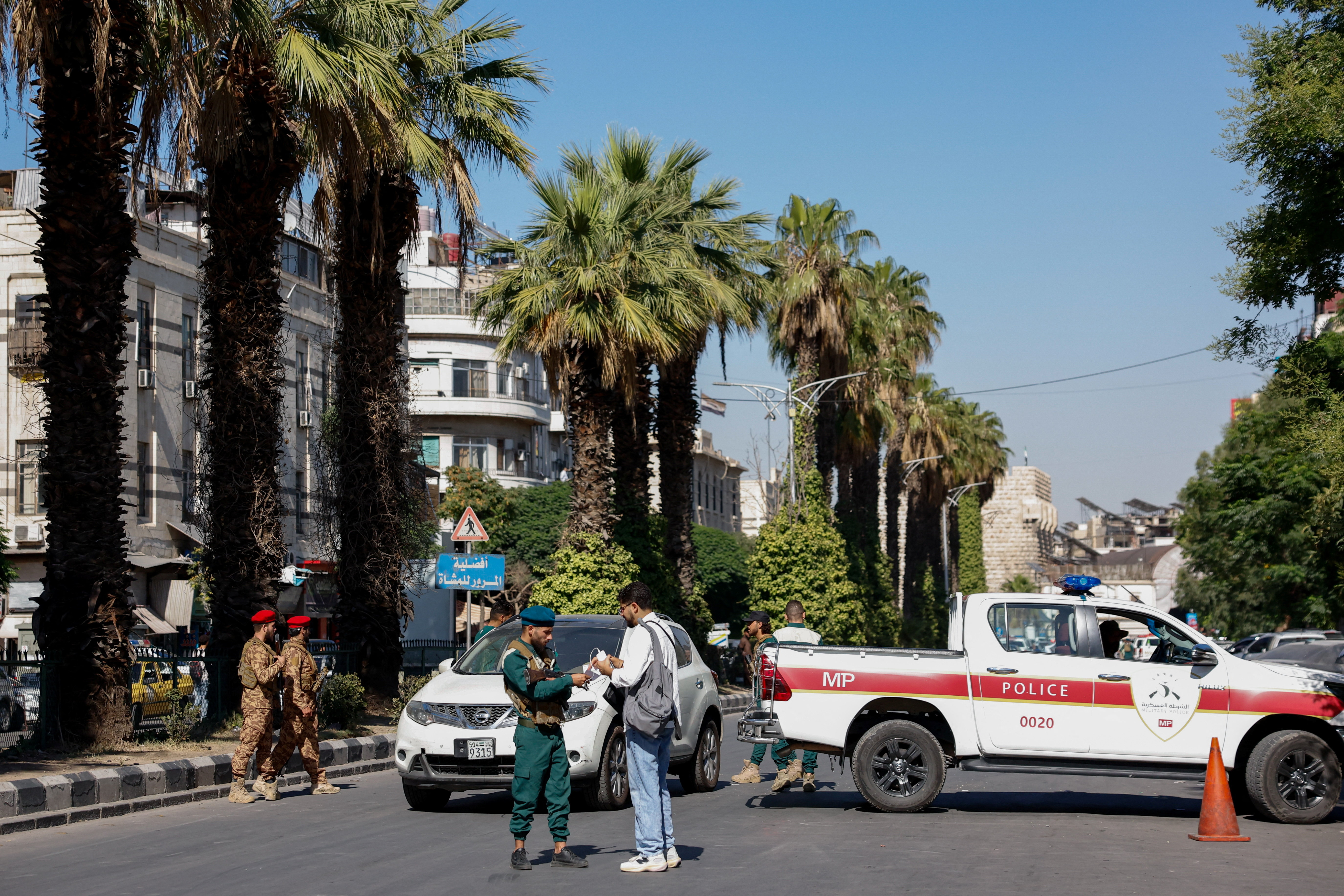 A police vehicle near the site of what Syrian state media reported was a blast at a cafe in central Damascus, Syria, July 2, 2026. REUTERS/Yamaam Al Shaar