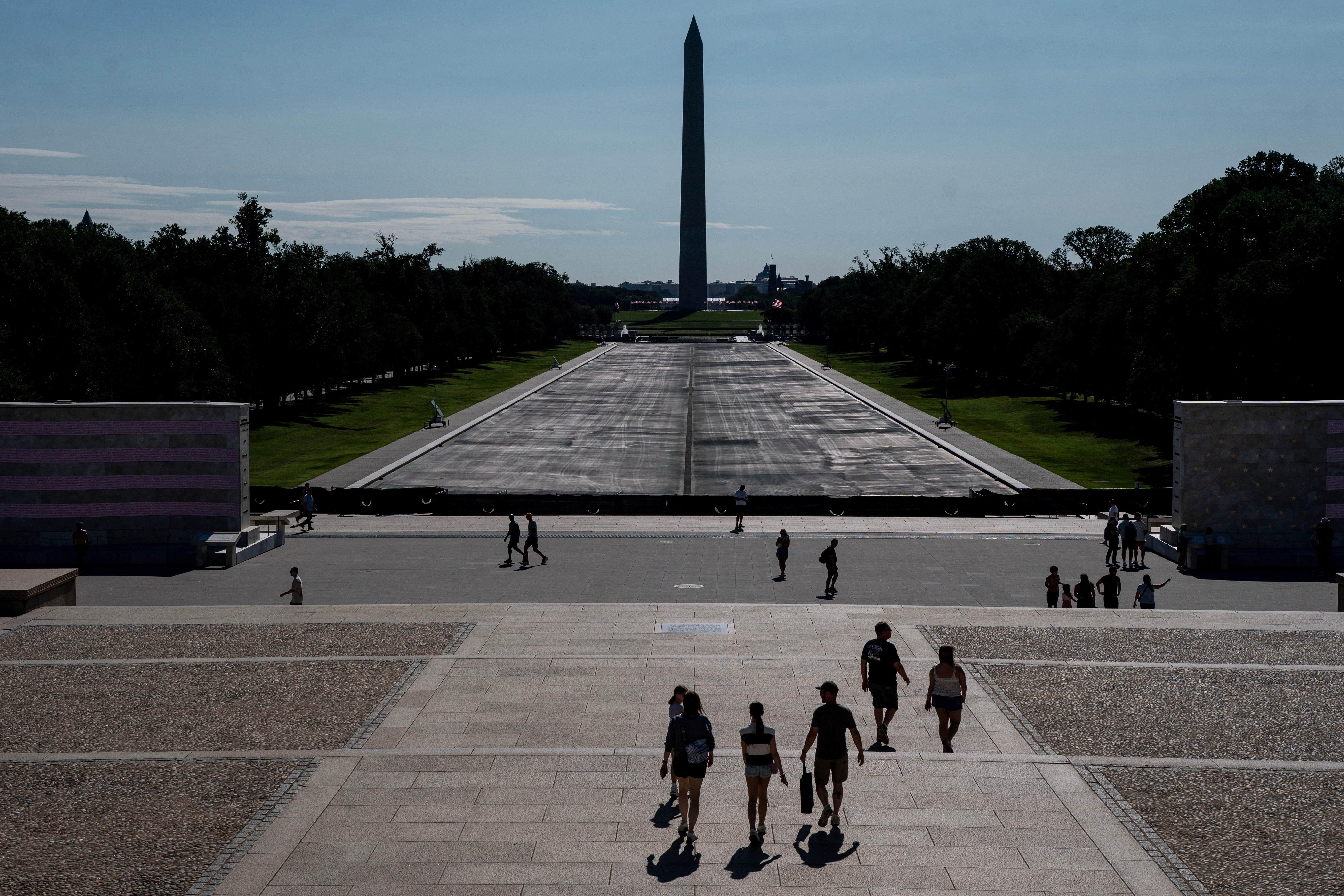 Visitors to the Lincoln Memorial walk near the drained Reflecting Pool, following renovations and Independence Day celebrations, in Washington, D.C., U.S., July 30, 2026. REUTERS/Nathan Howard
