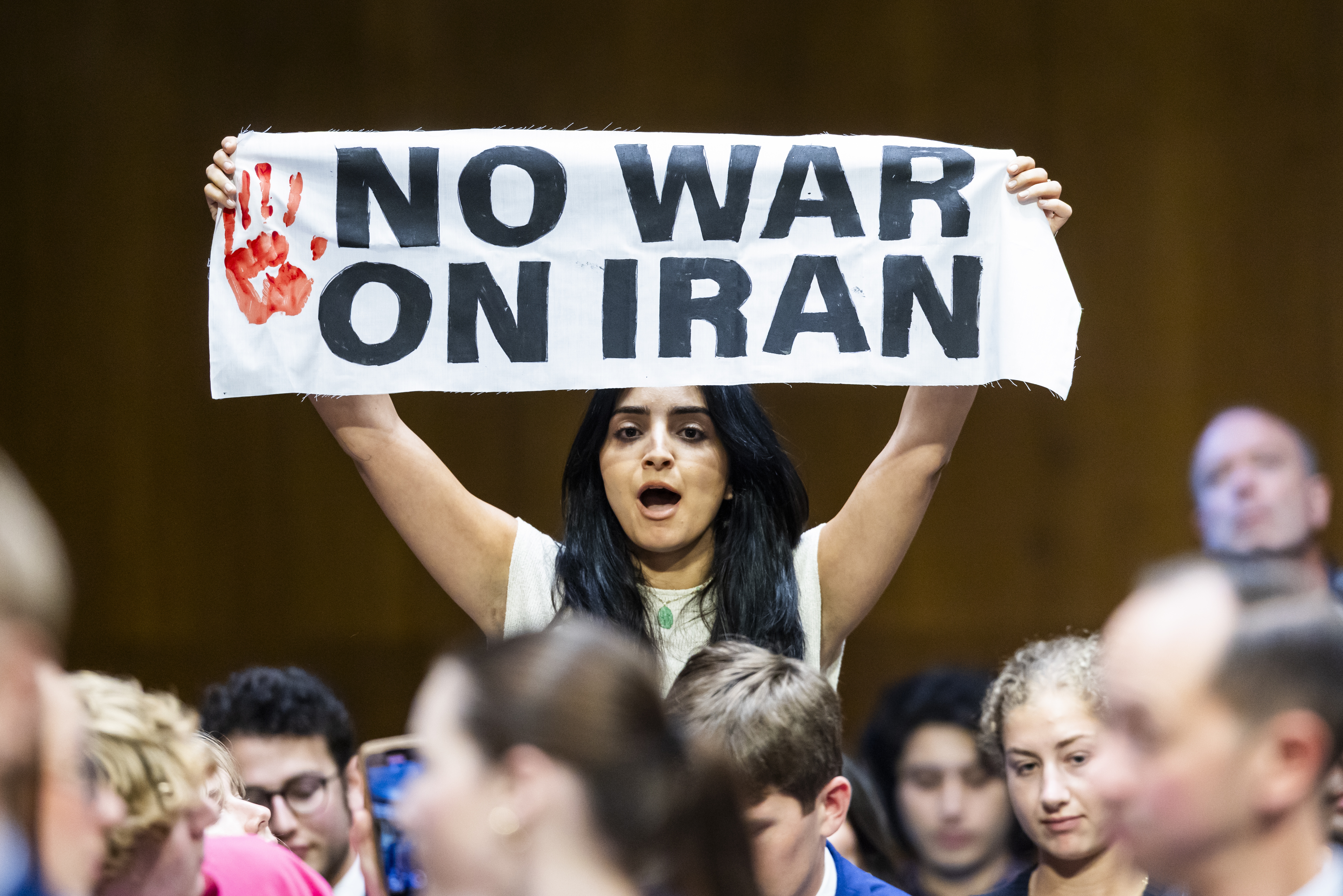 An anti-war protester stands up as US Secretary of Defense Hegseth and Chairman of the Joint Chiefs General John testify on the Defense Department's budget before the Senate Committee on Appropriations in the Dirksen Senate Office Building in Washington, DC, USA, 21 July 2026 (Jim Lo Scalzo/EPA)