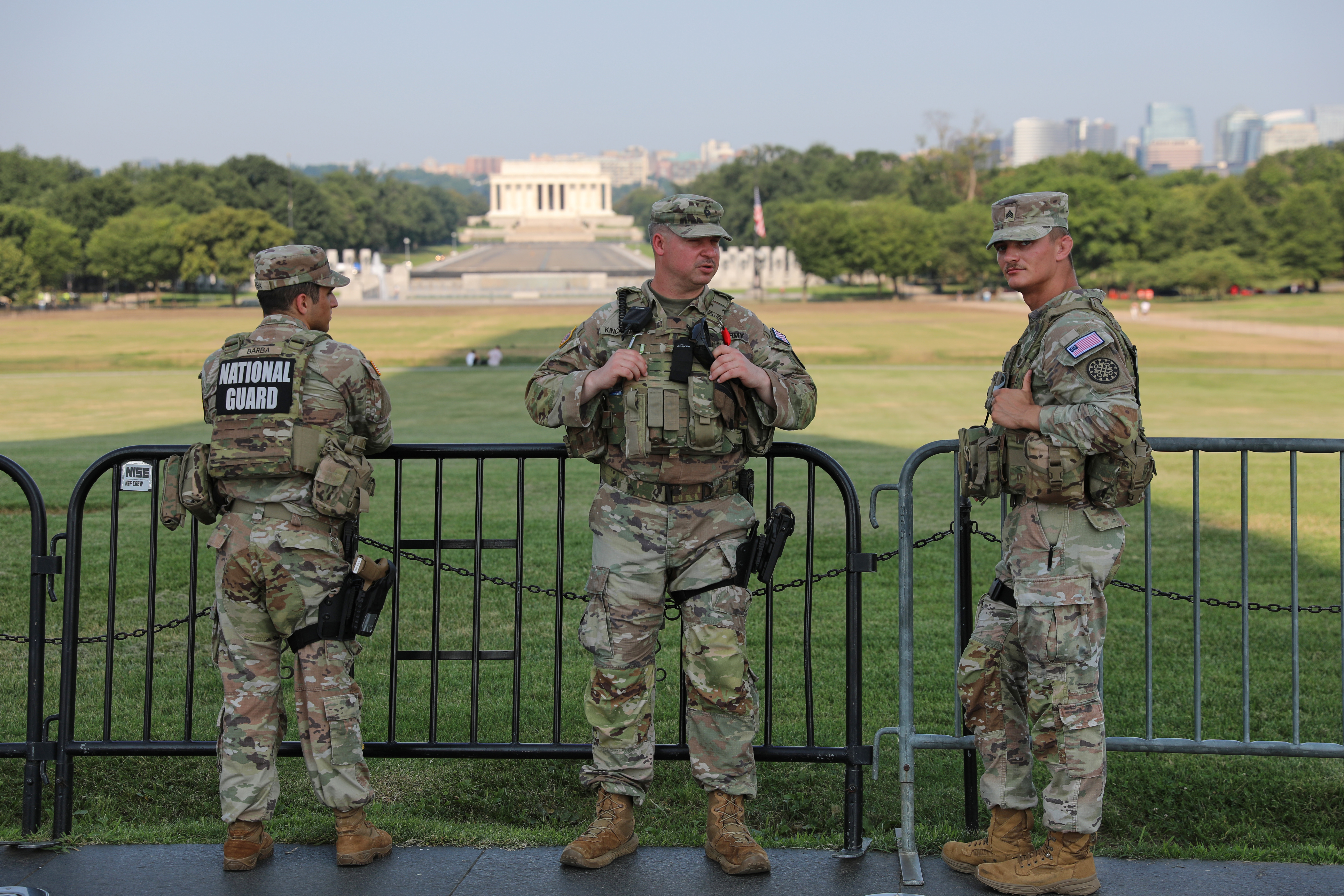 Member of the National Guard patrol at the base of the Washington Monument, Wednesday, July 15, 2026, in Washington. The Lincoln Memorial is in the background,