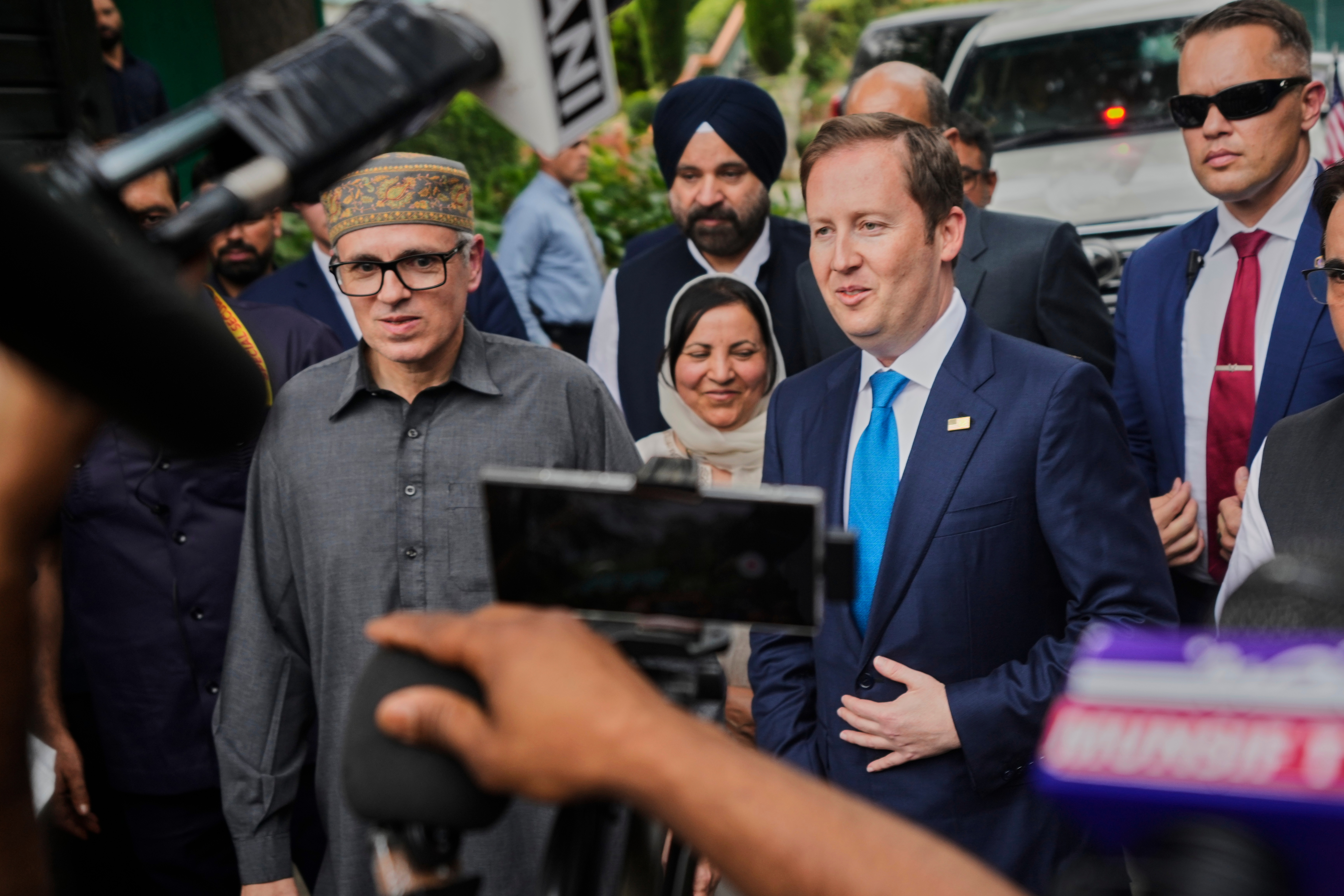 US Ambassador to India Sergio Gor talks to media as he stands next to Jammu and Kashmir's Chief Minister Omar Abdullah.