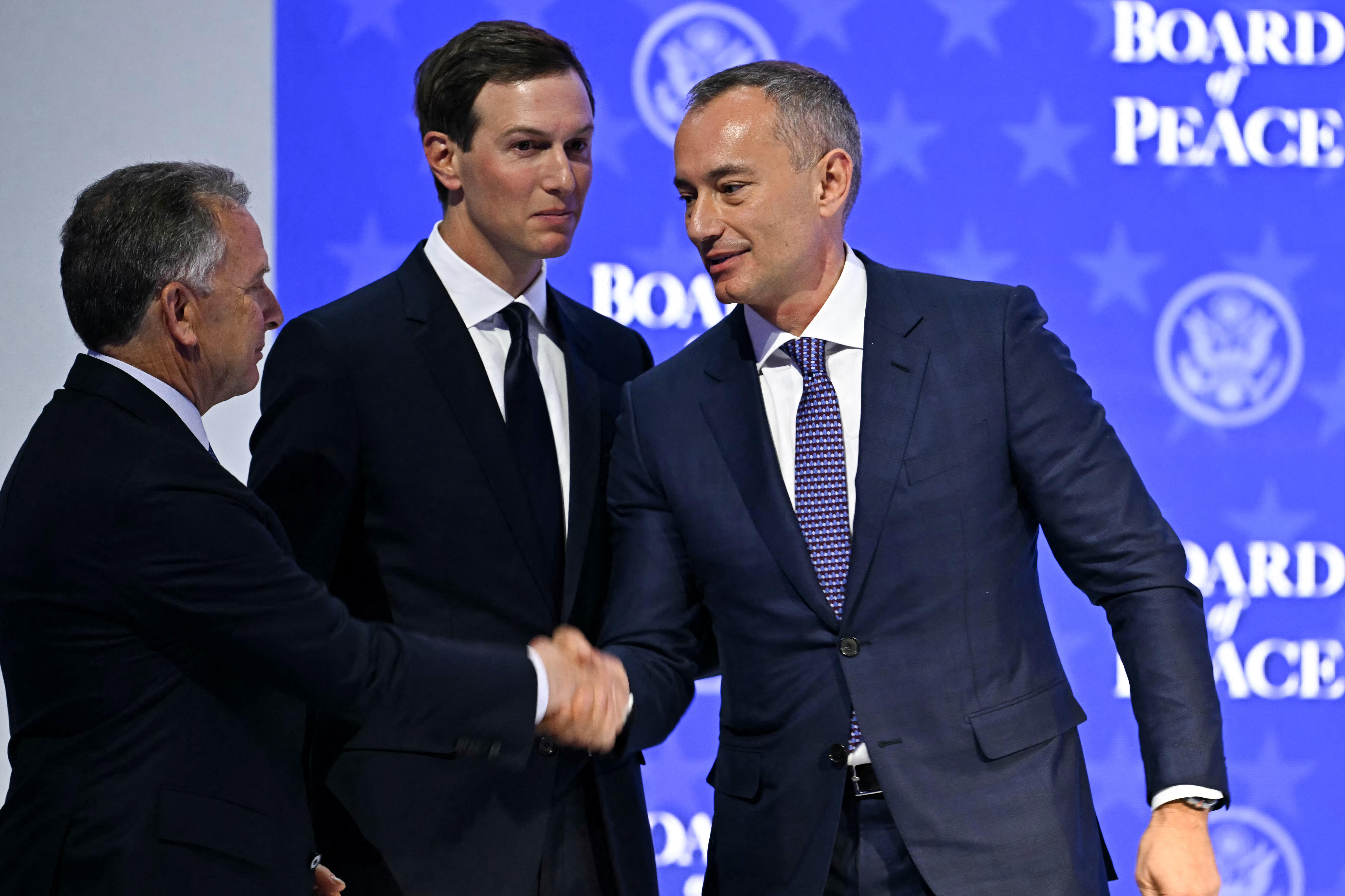 (FILES) US Special Envoy Steve Witkoff (L) shakes hands with Nickolay Mladenov, Bulgarian High Representative for Gaza (R) next to US businessman Jared Kushner at the "Board of Peace" meeting during the World Economic Forum (WEF) annual meeting in Davos on January 22, 2026.