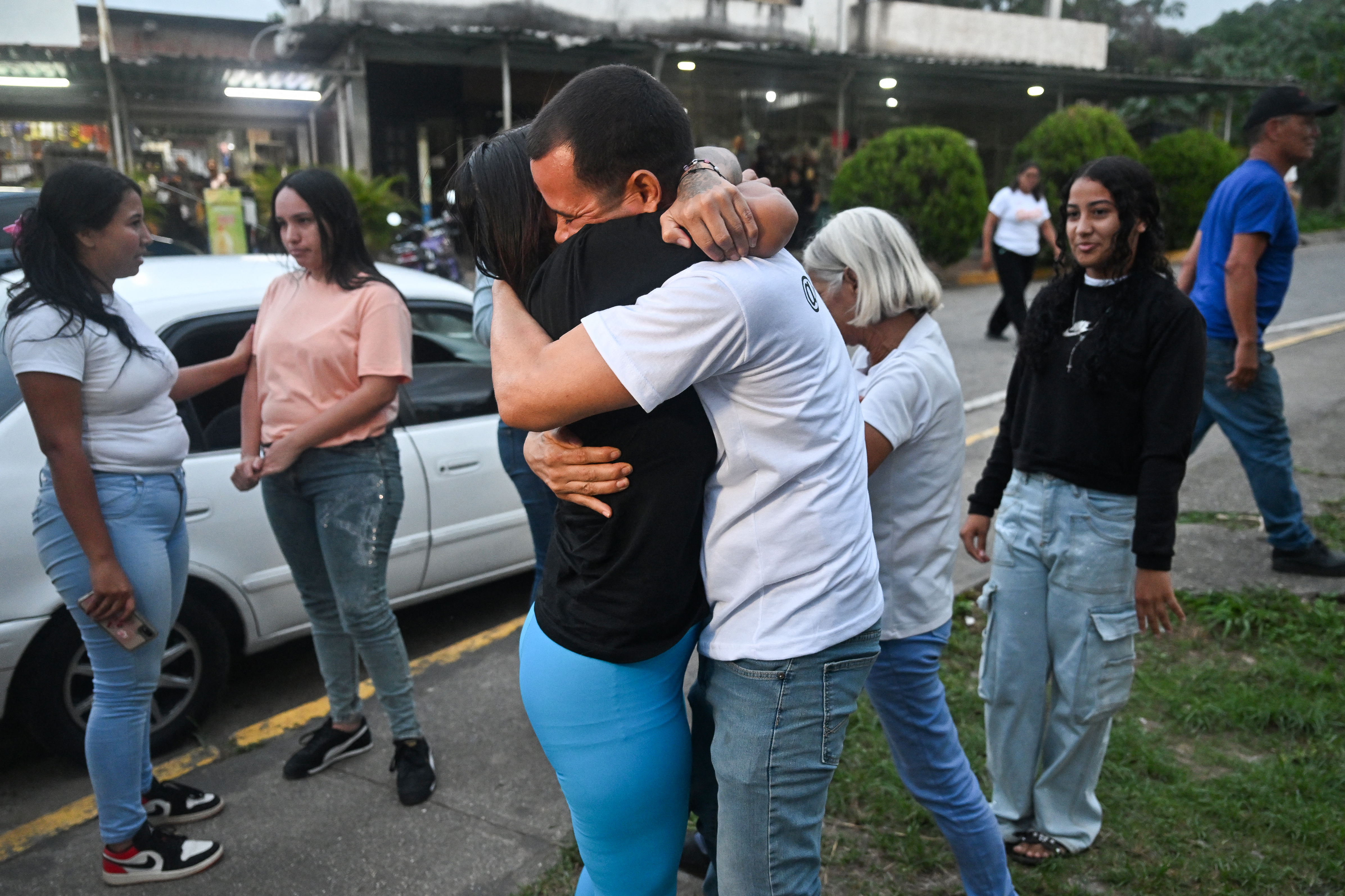Former political prisoner Angela Vasquez embraces her brother after her release outside El Rodeo I prison in Guatire, Miranda state, Venezuela, on August 14, 2026. [AFP]