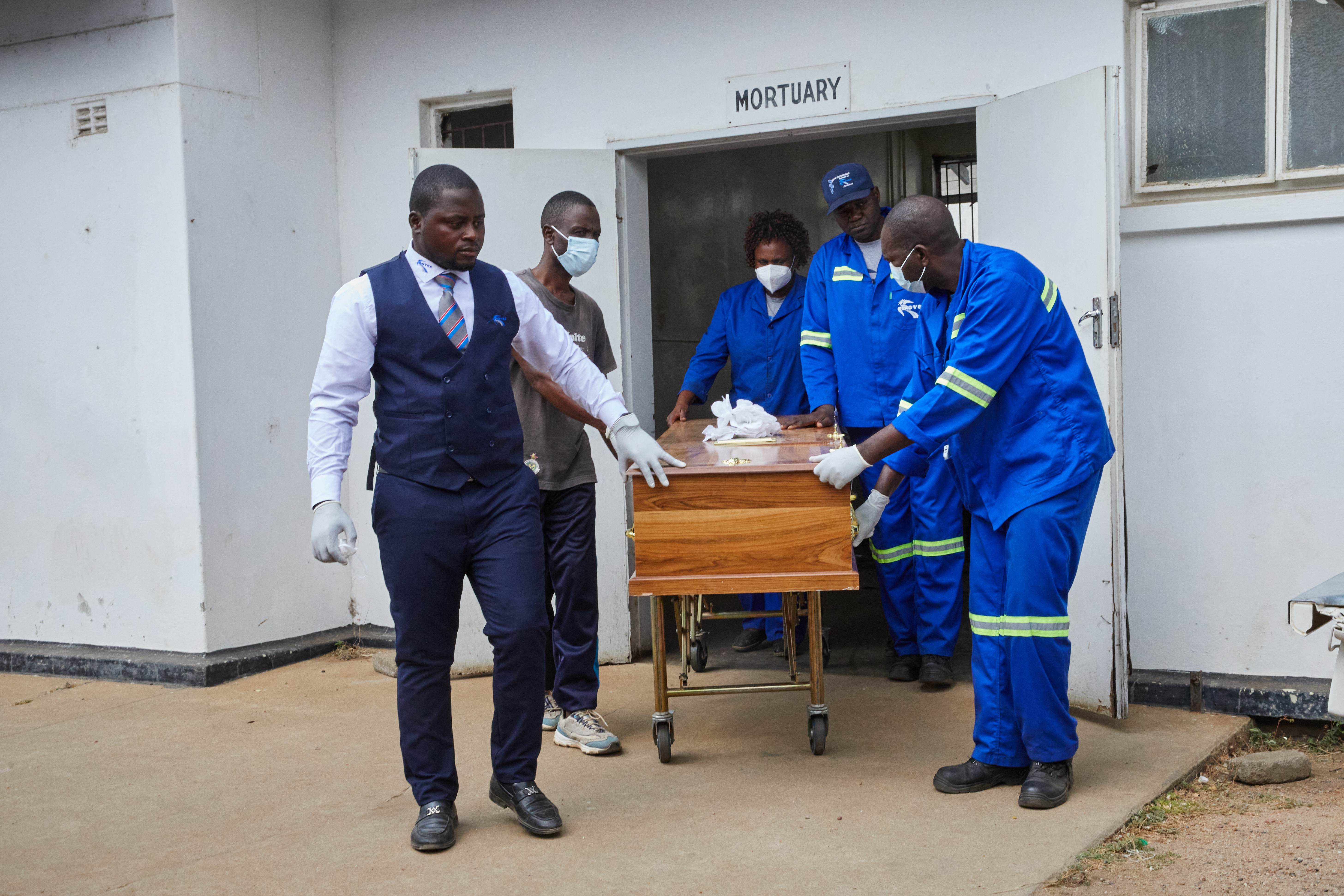 A coffin with the body of a victim of the capsized passenger ferry, leaves the Kariba Hospital mortuary after his body was identified for burial in Kariba, on August 14, 2026.
