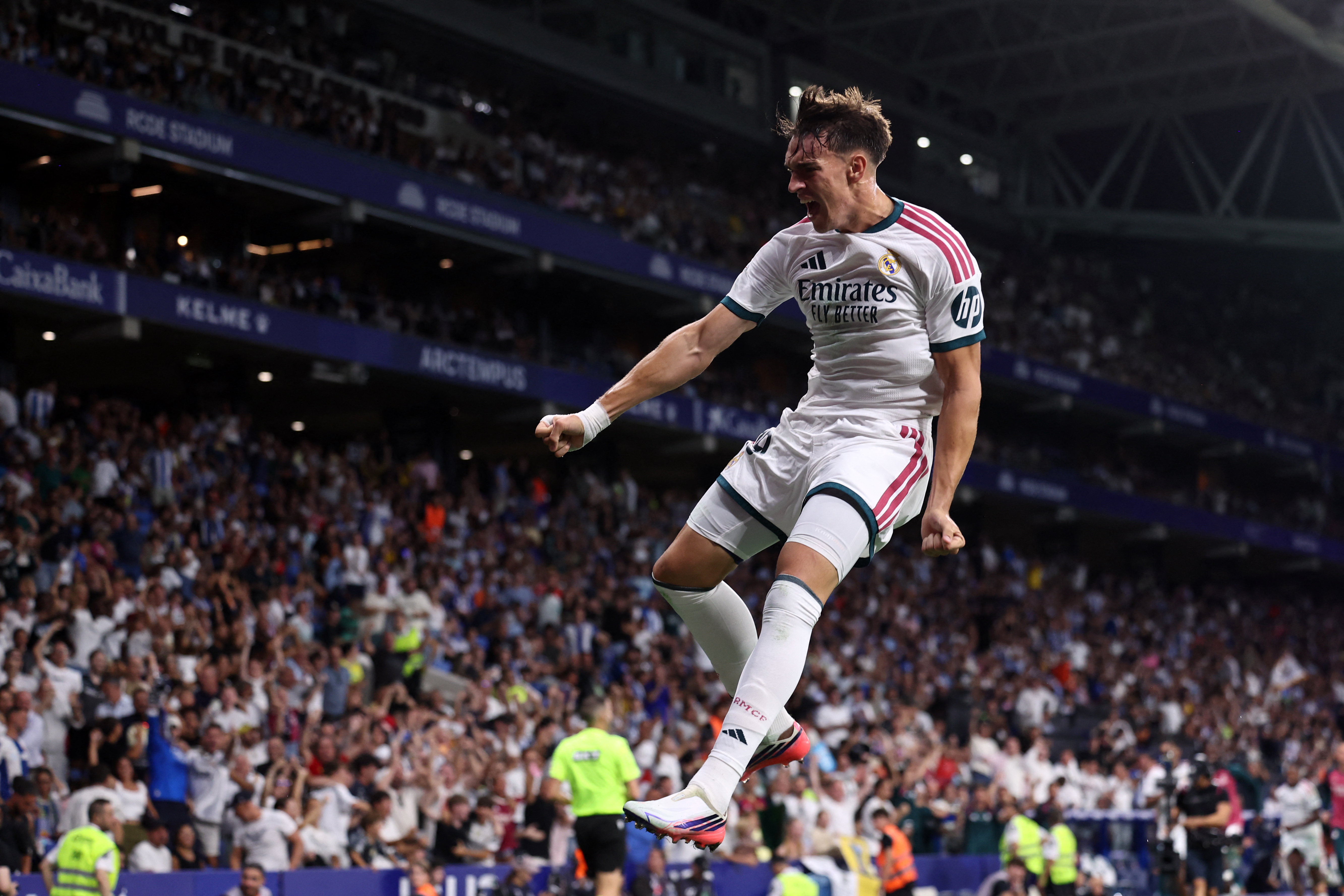 Real Madrid's Spanish forward #19 Carlos Espi Escrihuela celebrates scoring his team's second goal during the Spanish league football match between RCD Espanyol and Real Madrid CF at RCDE Stadium in Cornella de Llobregat on August 22, 2026. (Photo by Josep LAGO / AFP)