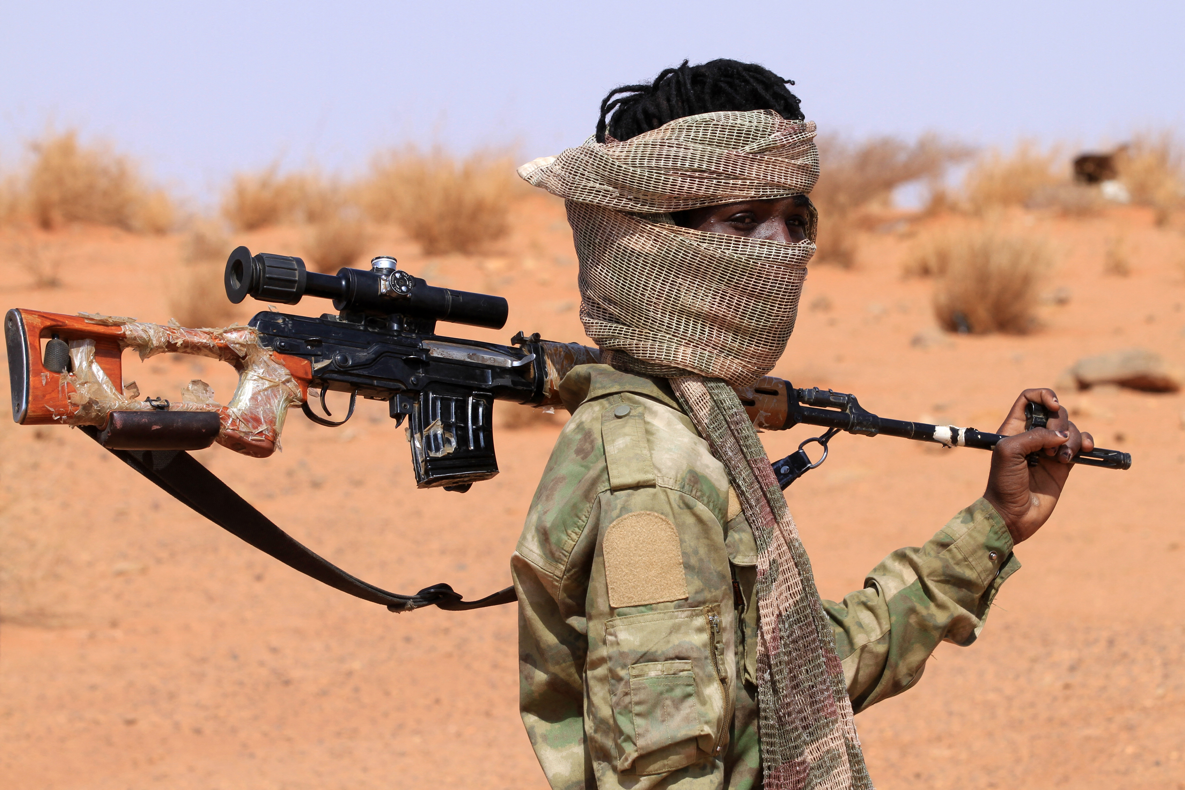 TOPSHOT - An armed defector from the paramilitary Rapid Support Forces (RSF) arrives as he is believed to be surrendering to the Sudanese military, in the west of Omdurman on August 19, 2026.