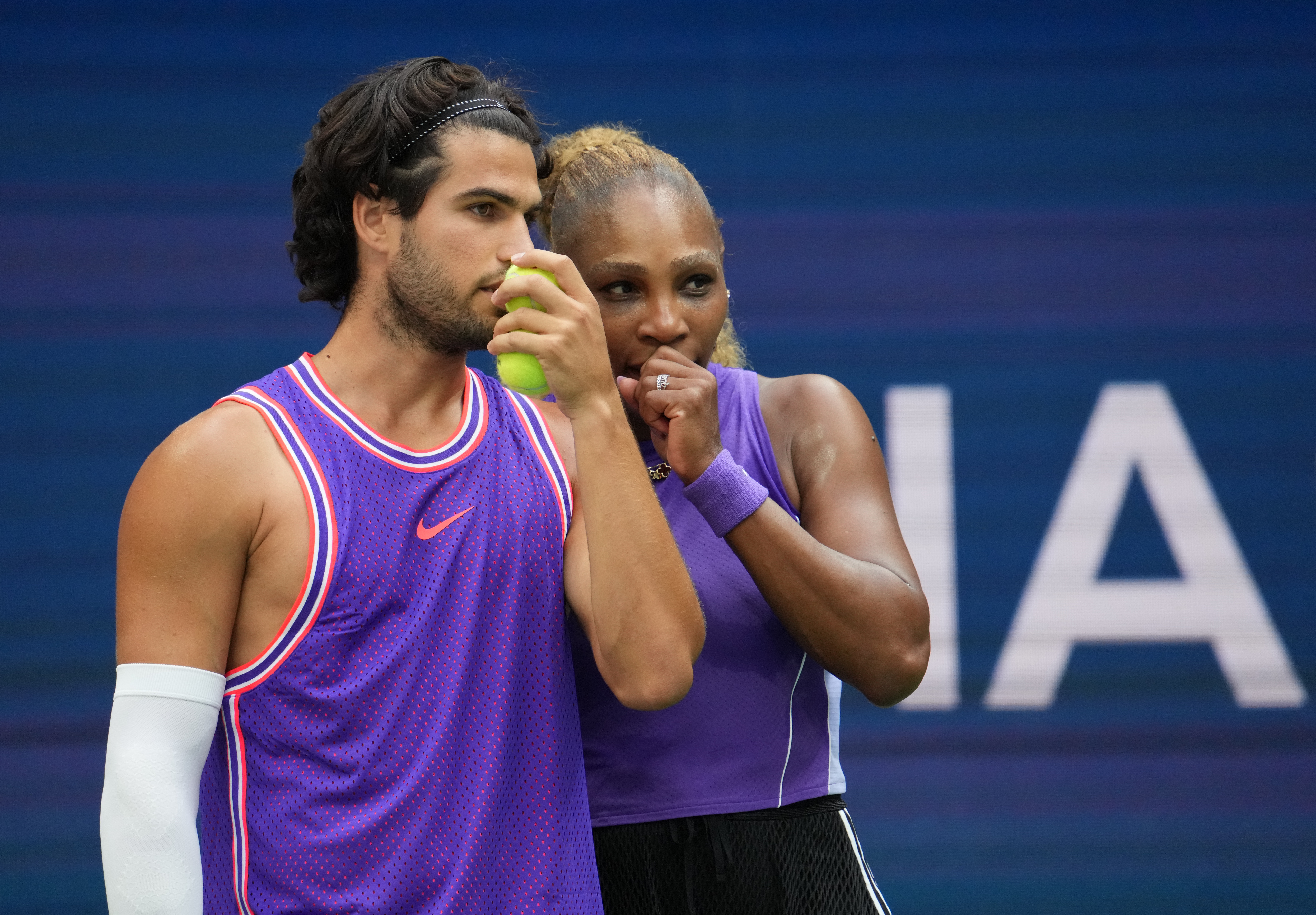 Carlos Alcaraz and Serena Williams confer during their mixed doubles match at the US Open
