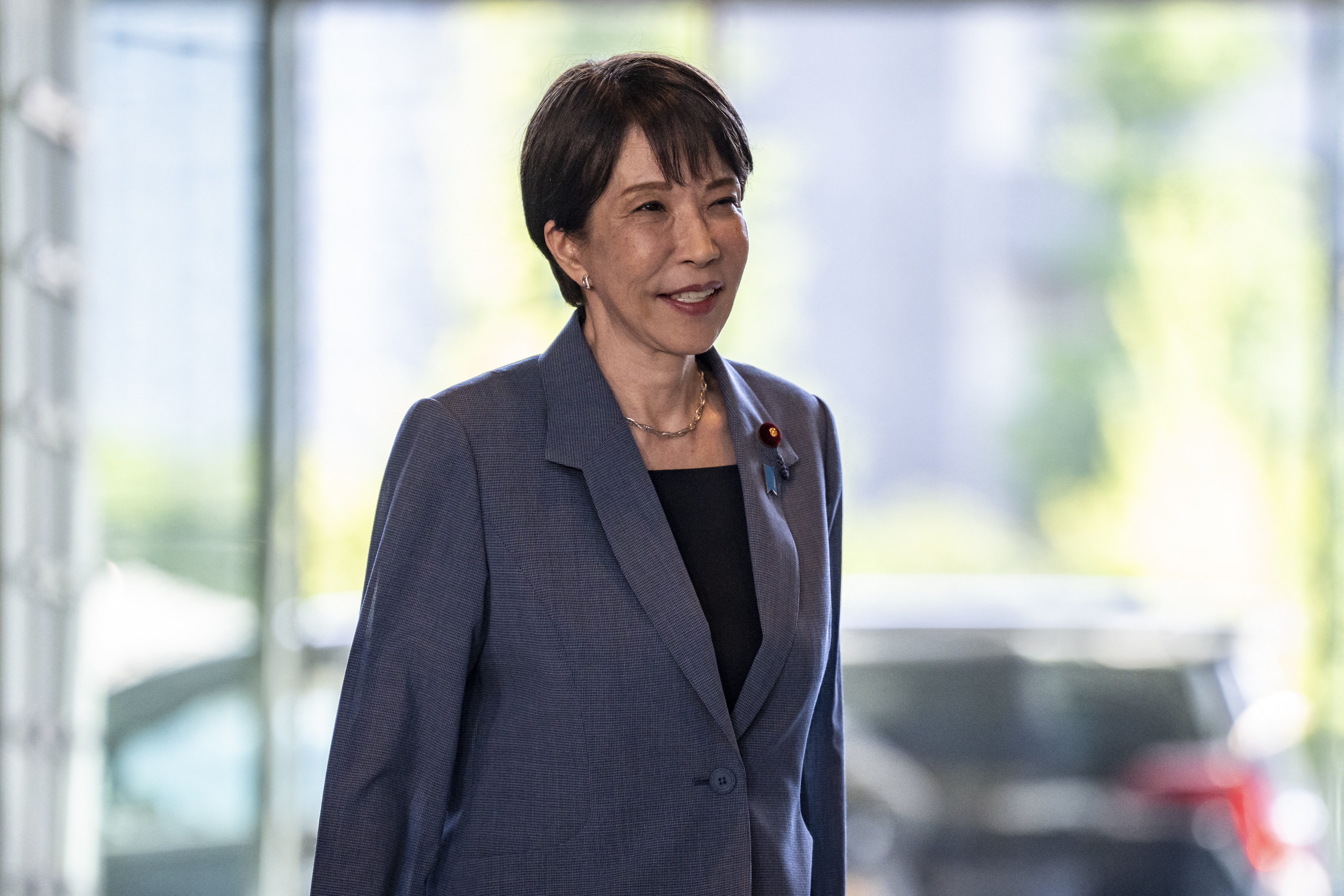 Japan's Prime Minister Sanae Takaichi arrives at the Prime Minister's office in Tokyo on August 25, 2026. (Photo by Yuichi YAMAZAKI / AFP)