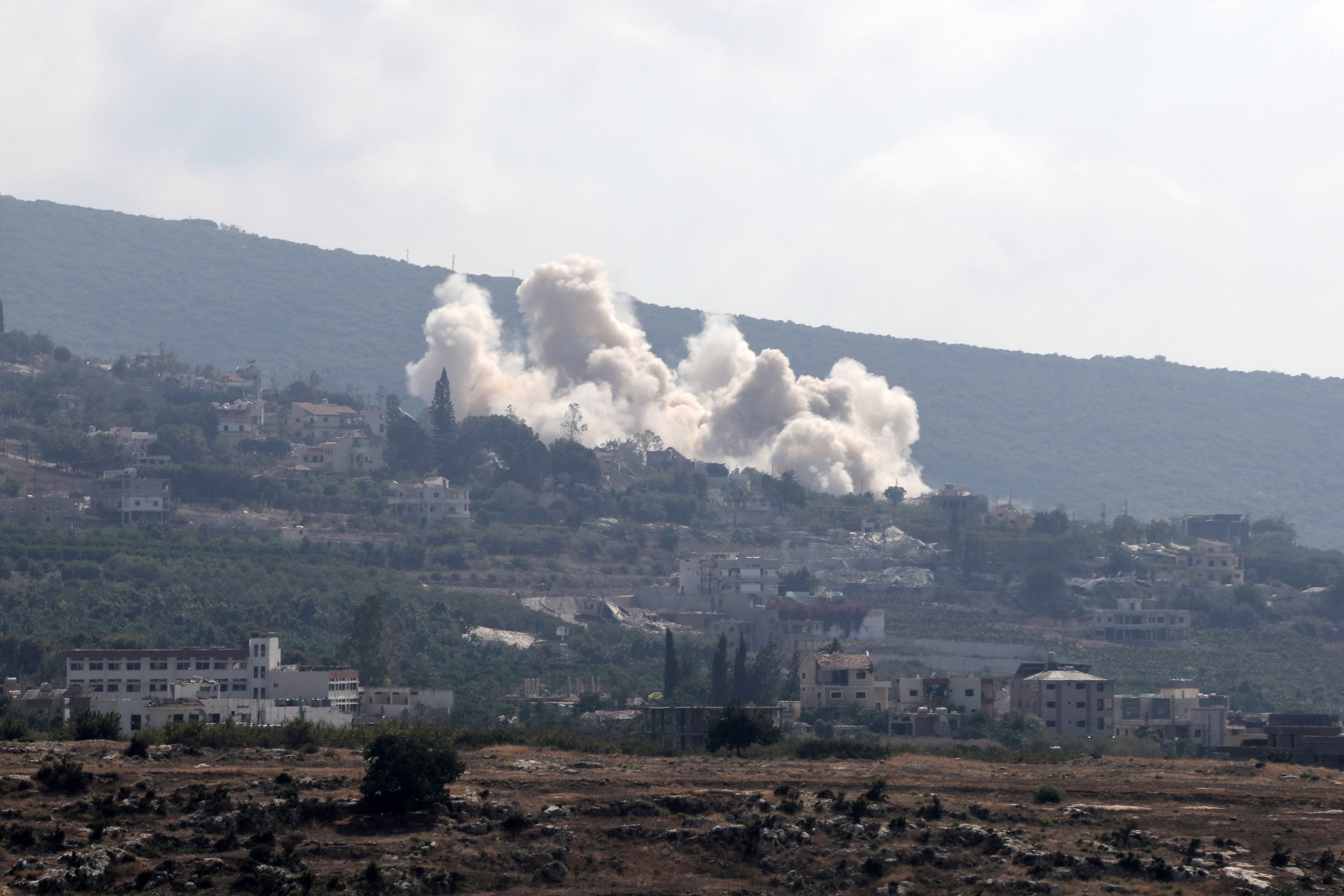 This photo taken from the southern Lebanese city of Tyre shows smoke rising following an Israeli strike that targeted the village of Biout es Sayed on August 26, 2026. (Photo by KAWNAT HAJU / AFP) / ATTENTION EDITORS: AFP COVERS THE WAR IN THE MIDDLE EAST THROUGH ITS EXTENSIVE REGIONAL NETWORK, INCLUDING BUREAUS IN TEHRAN, JERUSALEM, AND SEVERAL NEIGHBORING COUNTRIES. SINCE THE START OF THE CONFLICT, JOURNALISTS HAVE BEEN WORKING UNDER INCREASINGLY RESTRICTIVE CONDITIONS. AUTHORITIES IN SEVERAL COUNTRIES HAVE LIMITED REPORTERS' MOVEMENTS, PHOTO AND LIVE VIDEO COVERAGE FROM SENSITIVE LOCATIONS. SOME GOVERNMENTS AND ARMED GROUPS HAVE BANNED IMAGES OF MISSILE OR DRONE STRIKES AND OTHER SECURITY-RELATED SITES.