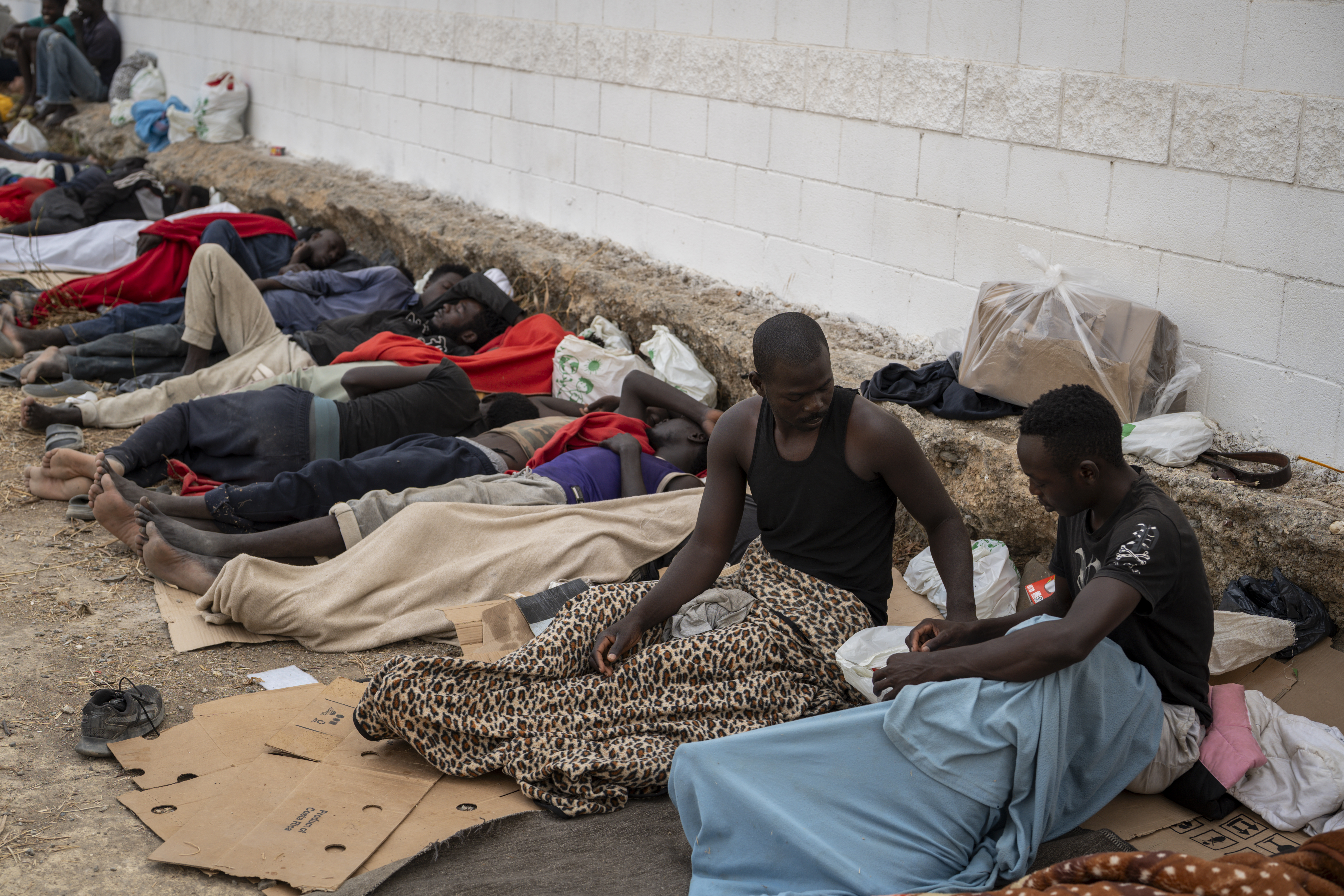 CEUTA, SPAIN - AUGUST 16: Migrants live under precarious conditions in El Trampolin beach on August 16, 2026 in Ceuta, Spain. Fears of a second surge of migrant crossings into the Spanish North African exclave of Ceuta have intensified following anonymous social media calls and false online rumours claiming that the border with Morocco will open. This follows the crisis in late-just where tens of thousands rushed the border due to misinformation surrounding a Spanish court ruling. One hundred deaths occurred as a result of 78000 migrants crossing from neighbouring Morocco. (Photo by Adri Salido/Getty Images)