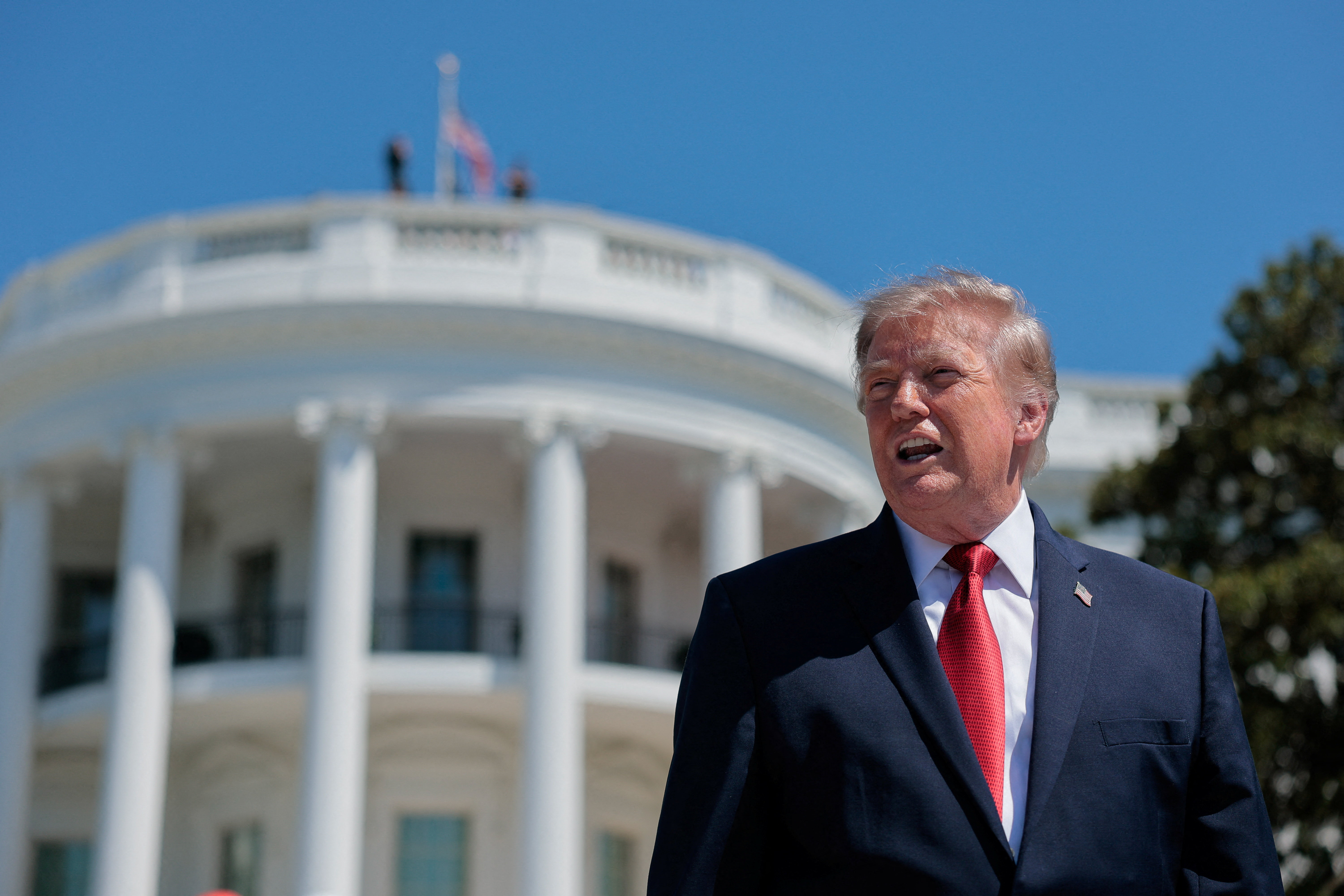 U.S. President Donald Trump speaks to reporters about the helipad being constructed on the South Lawn, at the White House in Washington, D.C., U.S., August 19, 2026. REUTERS/Kylie Cooper