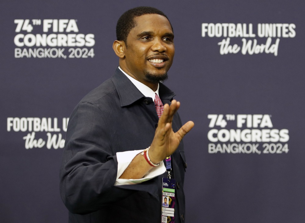 Former Cameroon's national soccer player Samuel Eto'o greets as he arrives to attend the 74th FIFA Congress