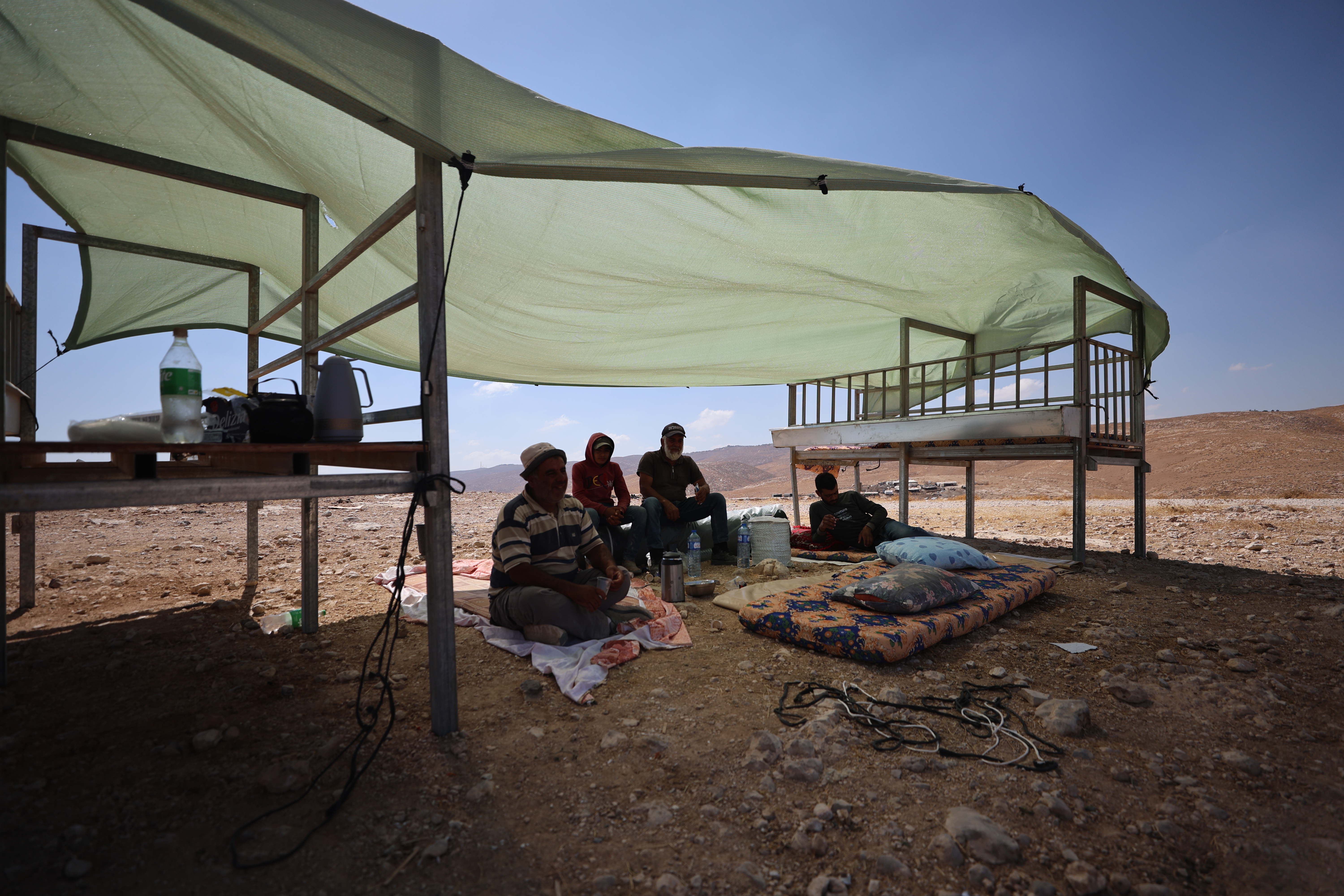 Palestinian villagers in Khirbet al-Tabban are finding whatever shelter they can from the sun after their homes were destroyed by Israeli forces