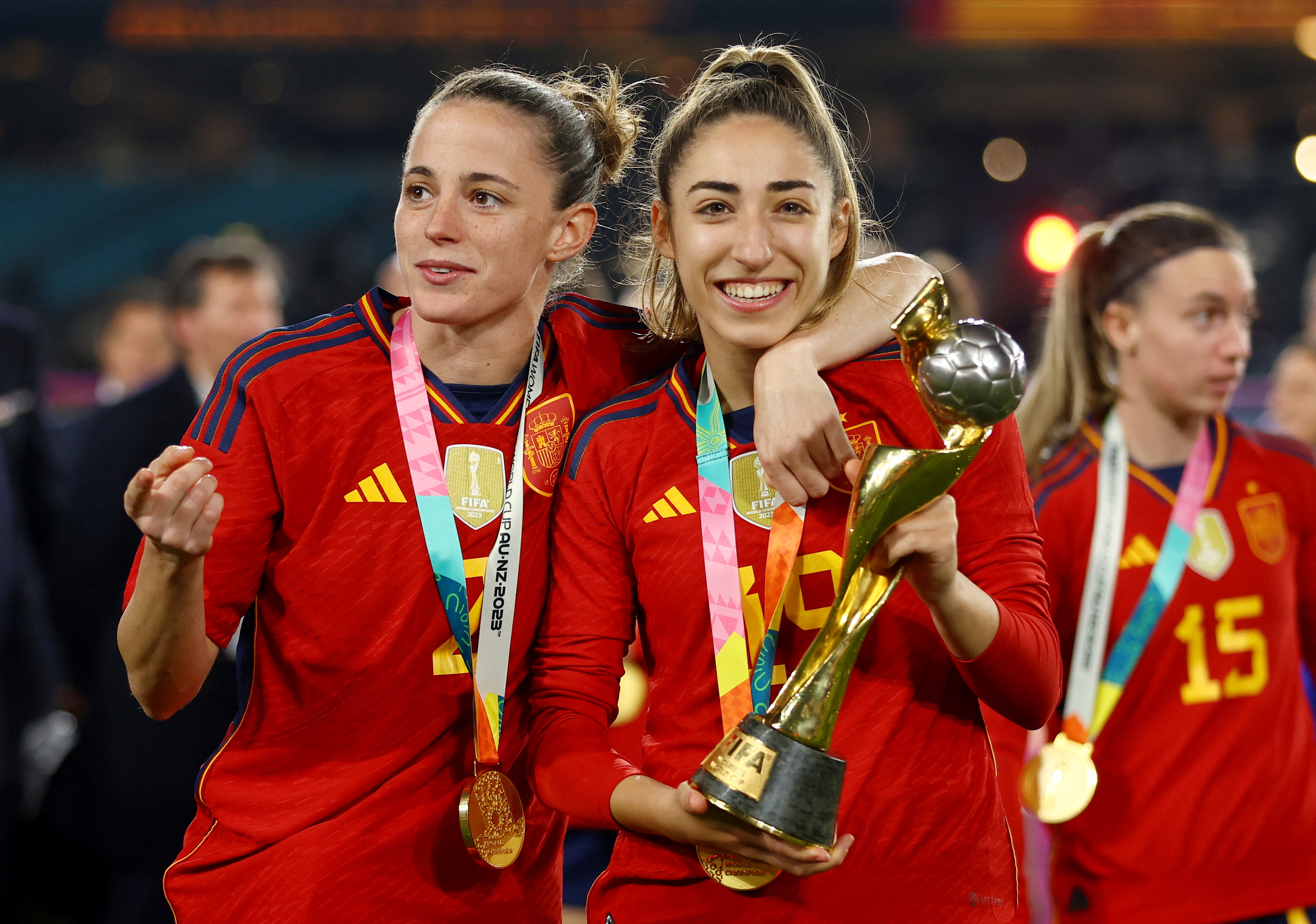 Spain's Olga Carmona and Ona Batlle celebrate with the trophy after winning the World Cup